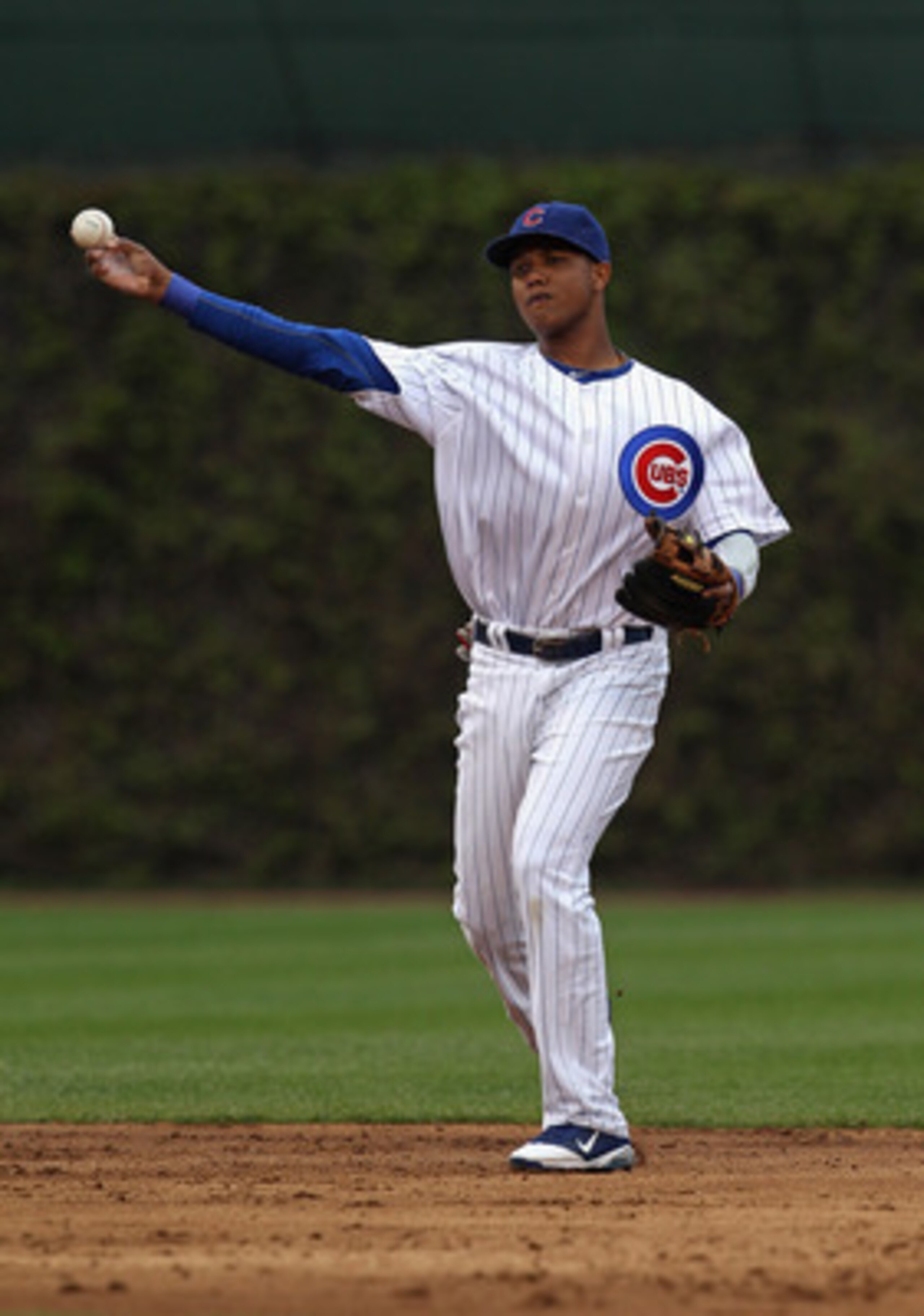 CHICAGO, IL - MAY 13:  Starlin Castro #13 of the Chicago Cubs throws to 1st base against the San Francisco Giants at Wrigley Field on May 13, 2011 in Chicago, Illinois. The Cubs defeated the Giants 11-4.  (Photo by Jonathan Daniel/Getty Images)