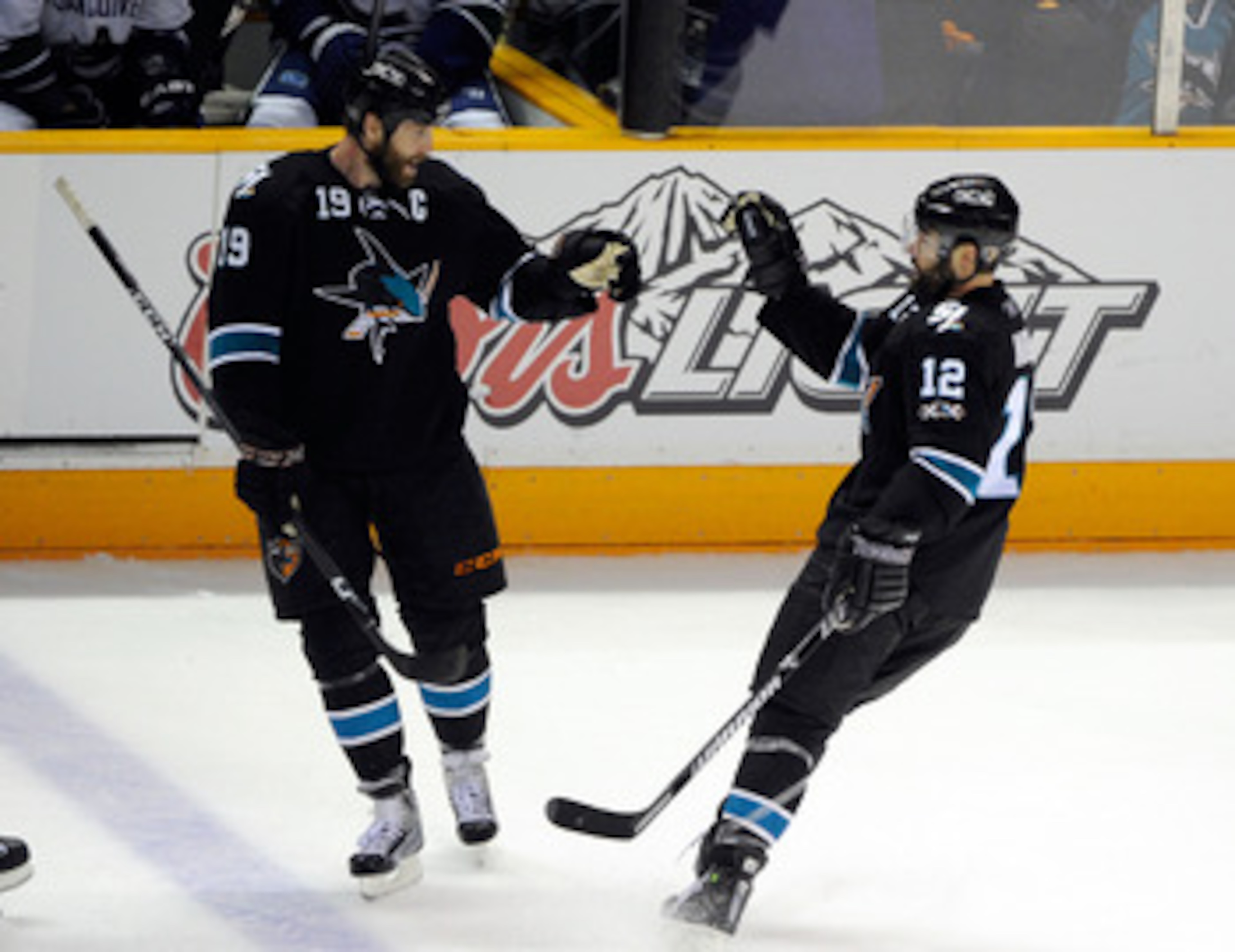 SAN JOSE, CA - MAY 20:  Joe Thornton #19 and Patrick Marleau #12 of the San Jose Sharks celebrate Marleau's second goal of the first period in Game Three of the Western Conference Finals during the 2011 Stanley Cup Playoffs at HP Pavilion on May 20, 2011
