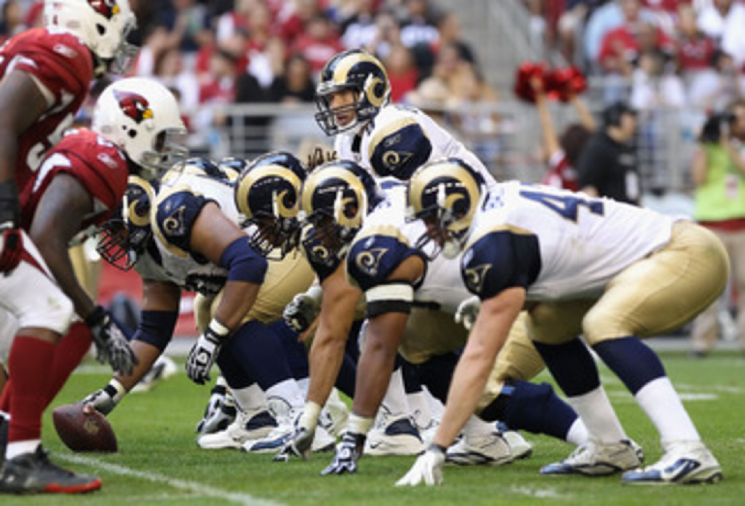 GLENDALE, AZ - DECEMBER 05:  Quarterback Sam Bradford #8 of the St. Louis Rams prepares to snap the ball during the NFL game against the Arizona Cardinals at the University of Phoenix Stadium on December 5, 2010 in Glendale, Arizona.  The Rams defeated th