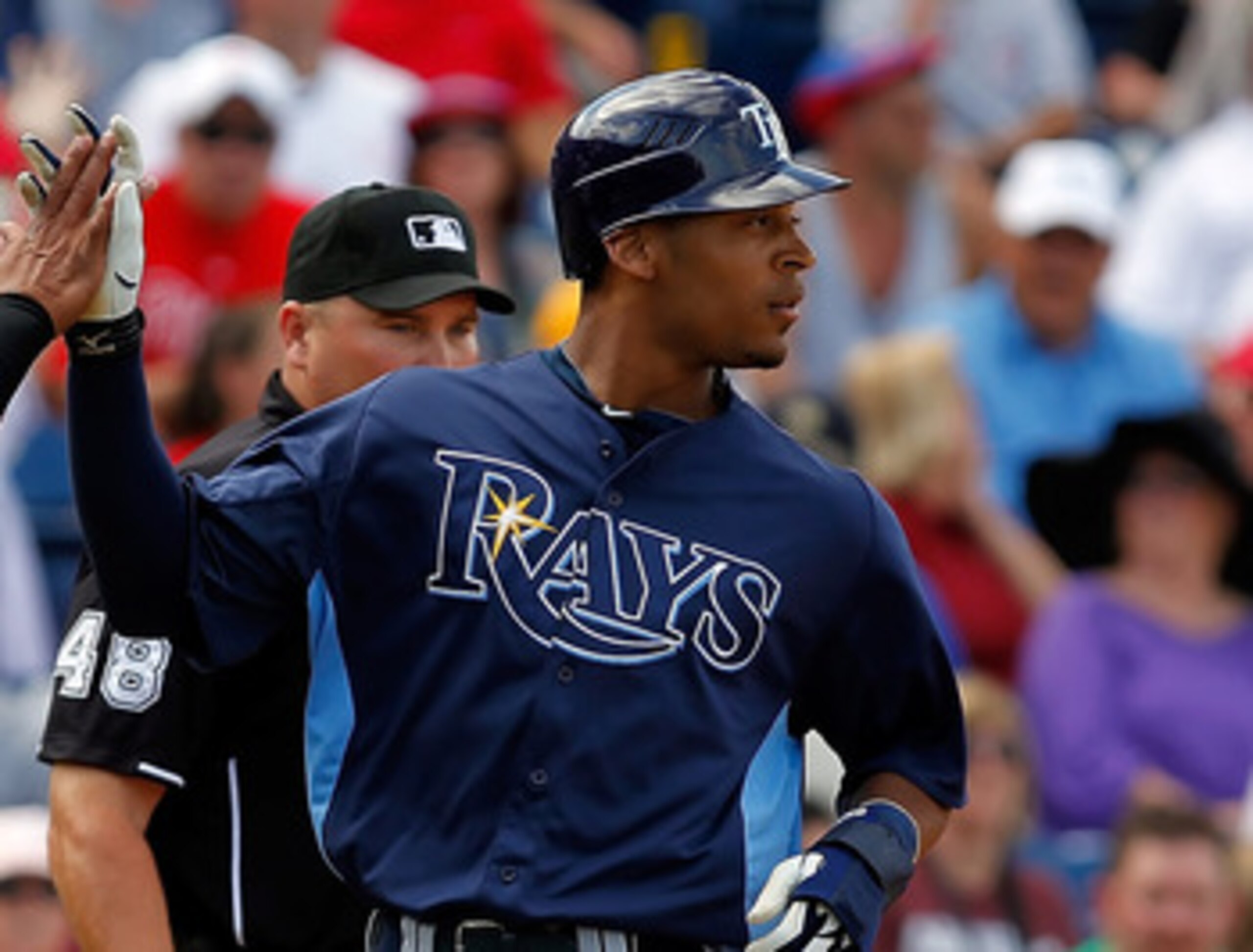 CLEARWATER, FL - MARCH 06: Outfielder Desmond Jennings #8 of the Tampa Bay Rays is congratulated by teammate Ray Olmedo #16 after scoring a run against the Philadelphia Phillies during a Grapefruit League Spring Training Game at Bright House Field on Mar CLEARWATER, FL - MARCH 06: Outfielder Desmond Jennings #8 of the Tampa Bay Rays is congratulated by teammate Ray Olmedo #16 after scoring a run against the Philadelphia Phillies during a Grapefruit League Spring Training Game at Bright House Field on Mar