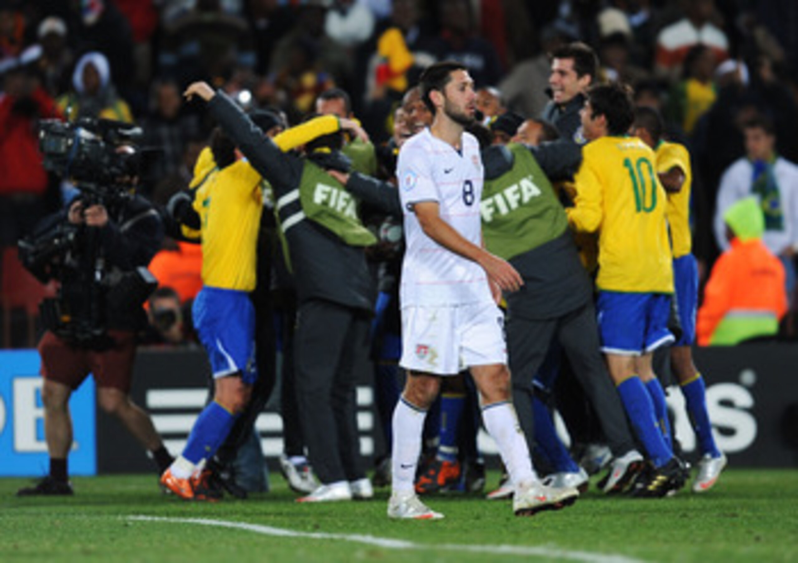 JOHANNESBURG, SOUTH AFRICA - JUNE 28:  Clint Dempsey of USA shows his dejection as Brazil celebrate victory at the end of the FIFA Confederations Cup Final between USA and Brazil at the Ellis Park Stadium on June 28, 2009 in Johannesburg, South Africa.  (