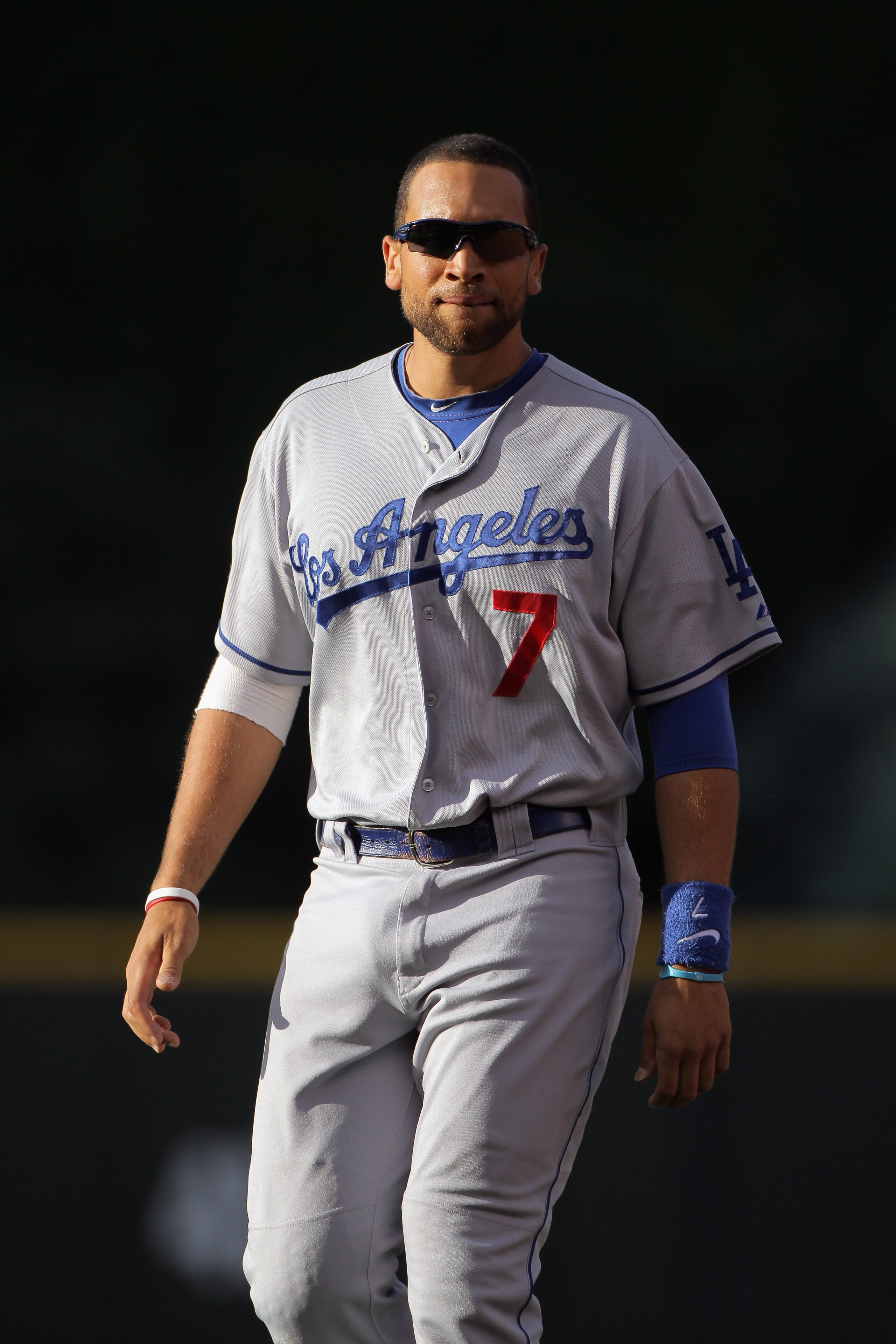 DENVER, CO - JUNE 10:  James Loney #7 of the Los Angeles Dodgers warms up as he prepares to face the Colorado Rockies at Coors Field on June 10, 2011 in Denver, Colorado.  (Photo by Doug Pensinger/Getty Images)