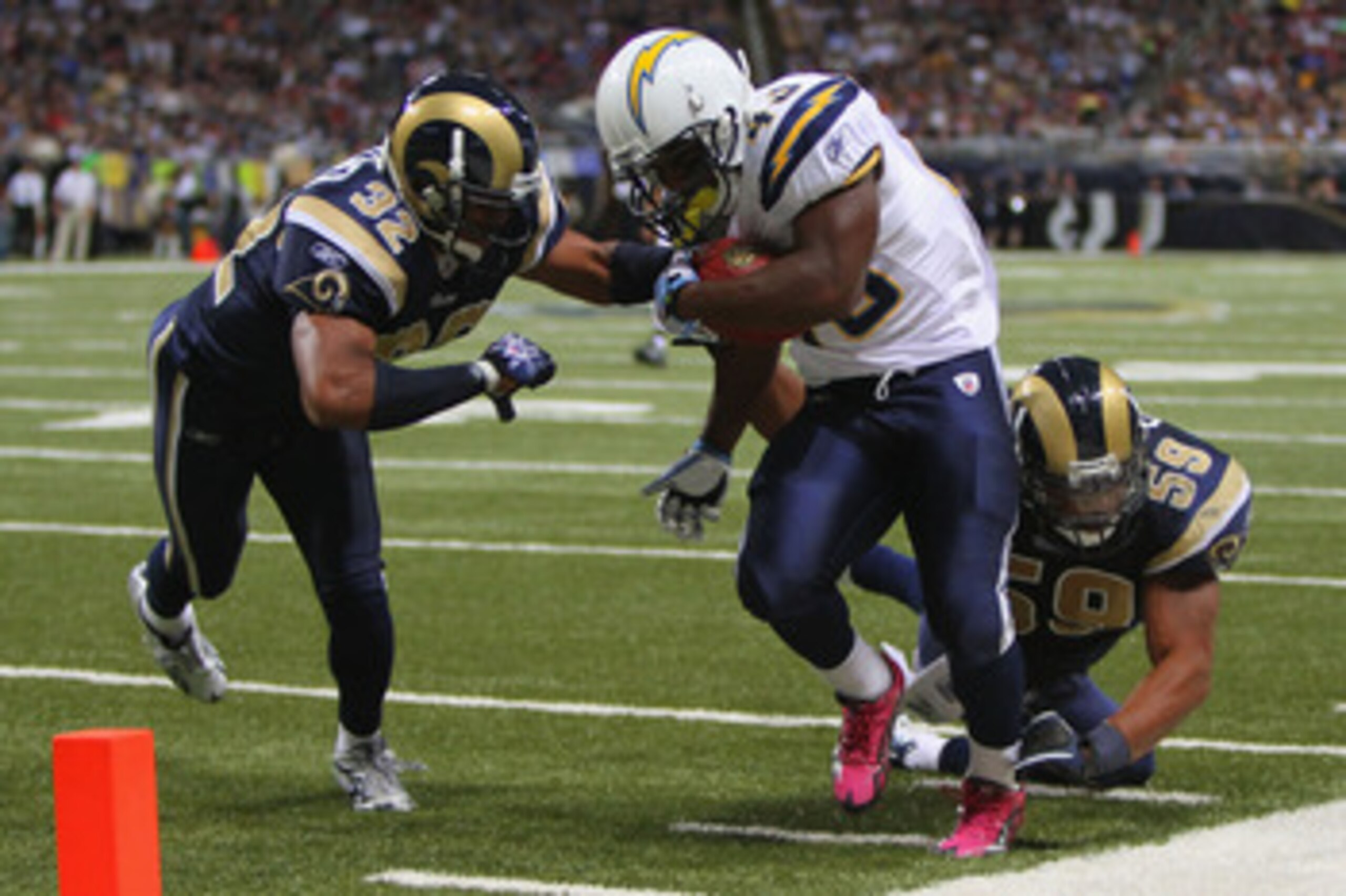 ST. LOUIS - OCTOBER 17: Darren Sproles #43 of the San Diego Chargers is pushed out of bounds by Bradley Fletcher #32 and Larry Grant #59 both of the St. Louis Rams at the Edward Jones Dome on October 17, 2010 in St. Louis, Missouri.  The Rams beat the Cha
