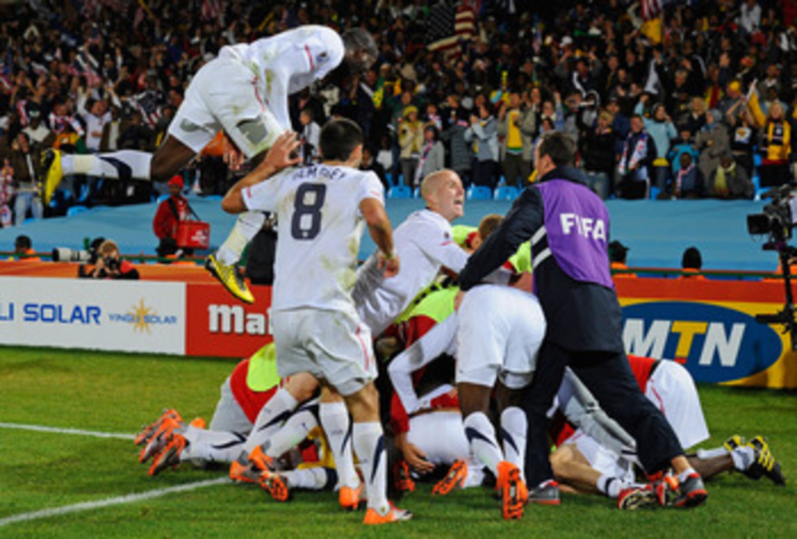 PRETORIA, SOUTH AFRICA - JUNE 23:  The USA team celebrate Landon Donovan's winning goal that sends the USA through to the second round during the 2010 FIFA World Cup South Africa Group C match between USA and Algeria at the Loftus Versfeld Stadium on June