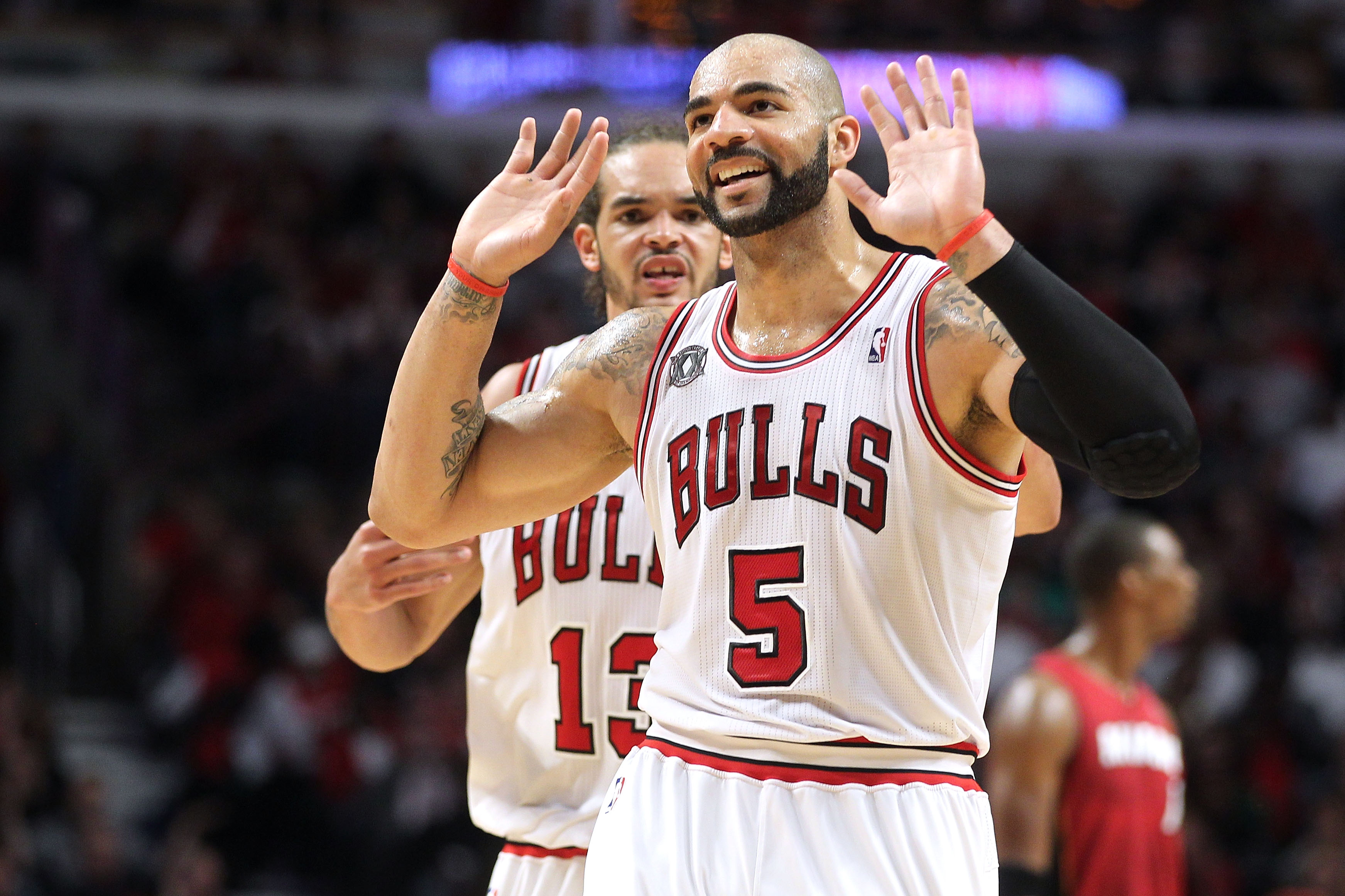 CHICAGO, IL - MAY 26:  Carlos Boozer #5 and Joakim Noah #13 of the Chicago Bulls looks on against the Miami Heat in Game Five of the Eastern Conference Finals during the 2011 NBA Playoffs on May 26, 2011 at the United Center in Chicago, Illinois. The Heat