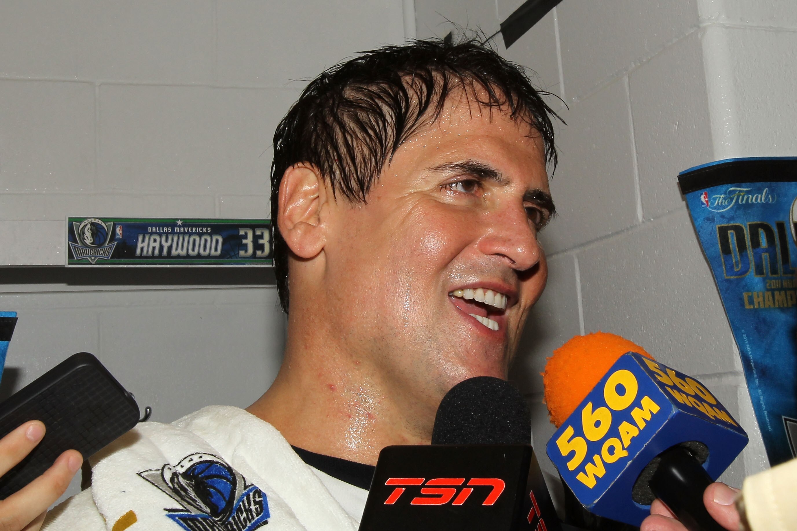 MIAMI, FL - JUNE 12:  Team owner Mark Cuban of the Dallas Mavericks is interviewed in the locker room after the Mavericks won 105-95 againstv the Miami Heat in Game Six of the 2011 NBA Finals at American Airlines Arena on June 12, 2011 in Miami, Florida.