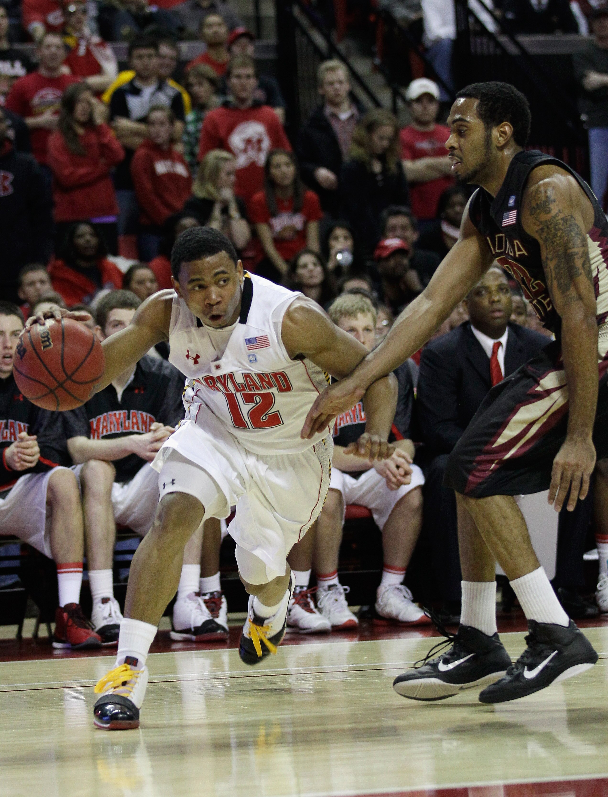 COLLEGE PARK, MD - FEBRUARY 23: Terrell Stoglin #12 of the Maryland Terrapins drives against the defense of Derwin Kitchen #22 of the Florida State Seminoles at the Comast Center February 23, 2011 in College Park, Maryland.  (Photo by Rob Carr/Getty Image