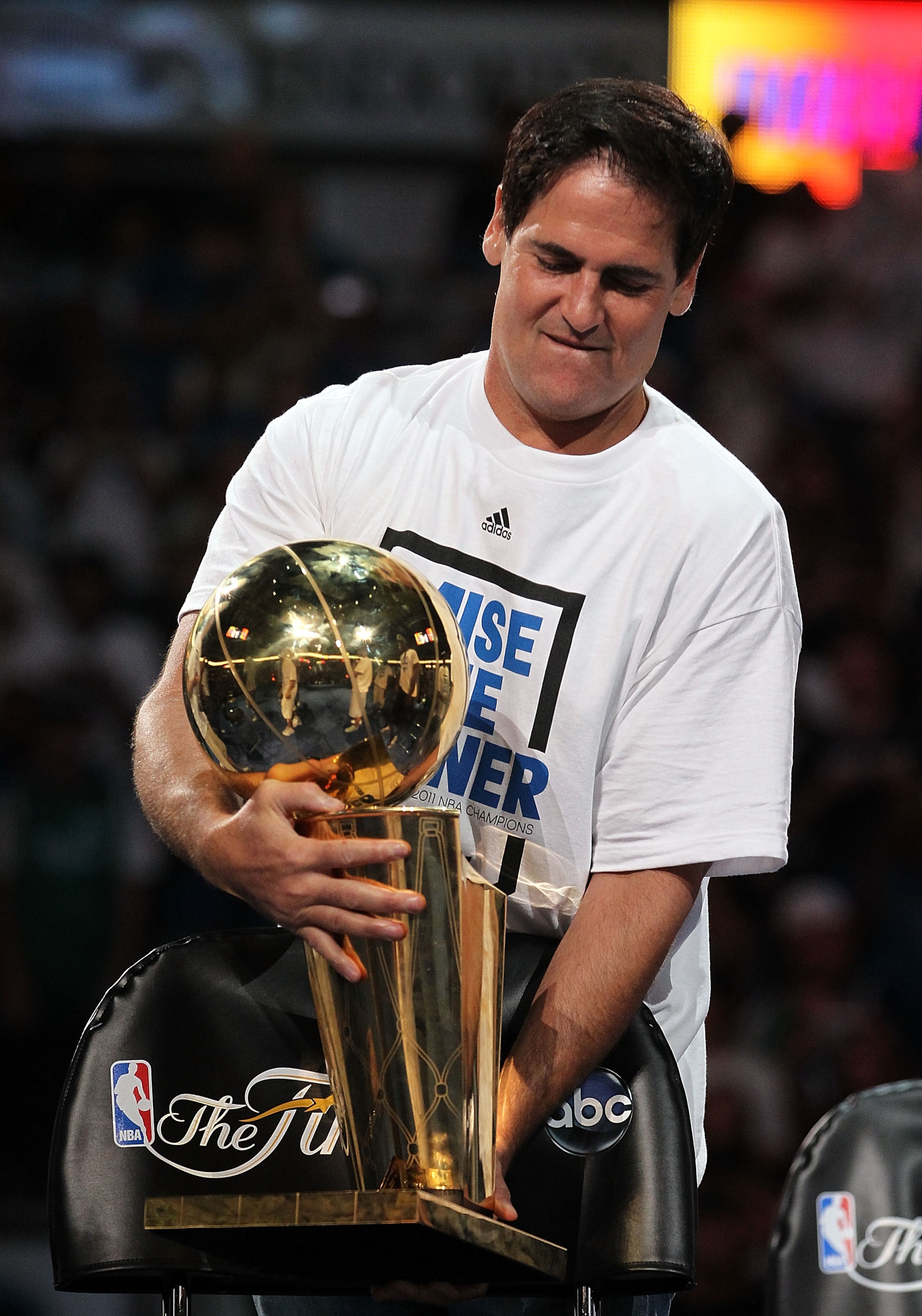 DALLAS, TX - JUNE 16:  Team owner Mark Cuban of the Dallas Mavericks with the NBA Trophy after the Dallas Mavericks Victory Parade at American Airlines Center on June 16, 2011 in Dallas, Texas.  (Photo by Ronald Martinez/Getty Images)