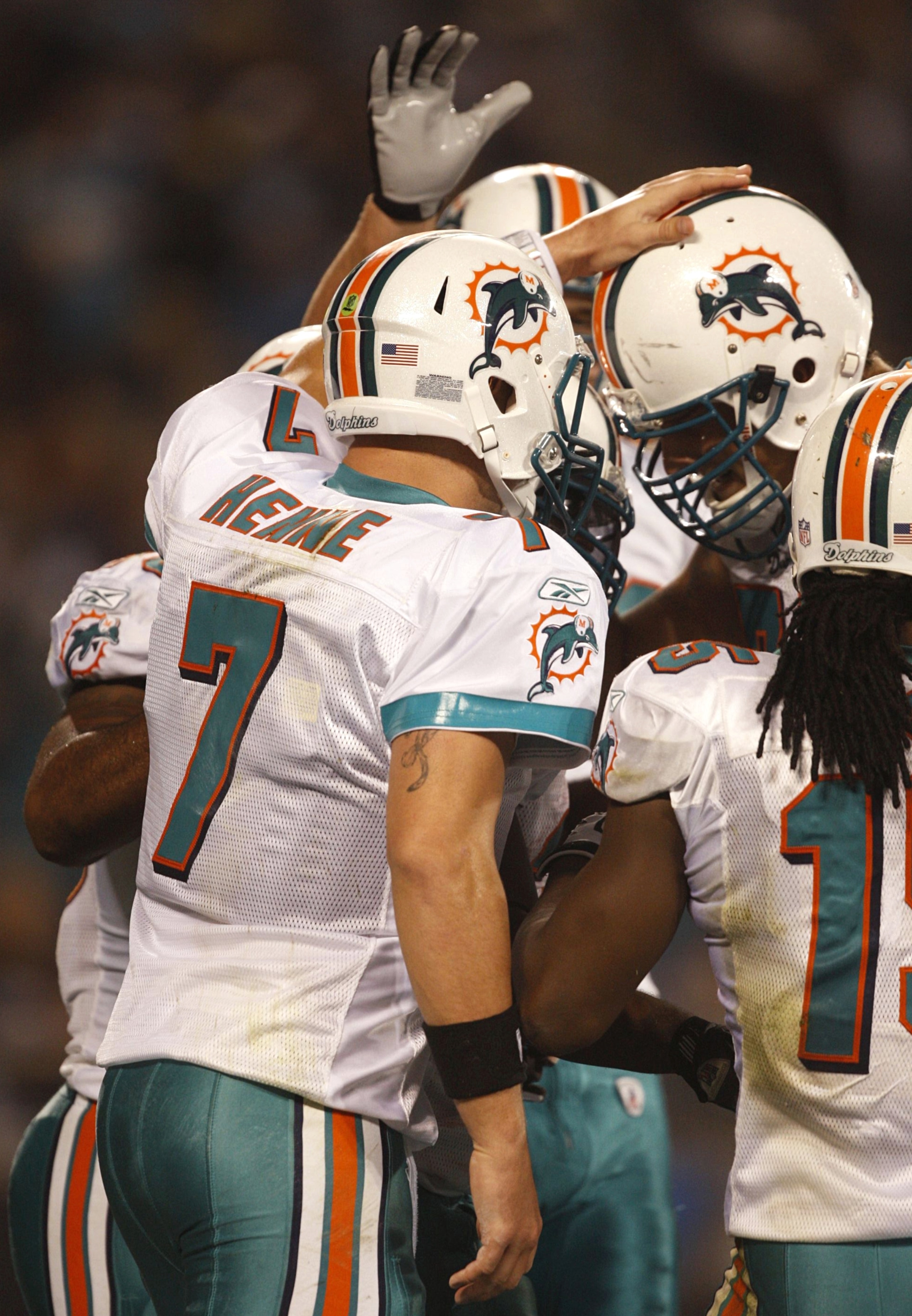 CHARLOTTE - NOVEMBER 19: Quarterback Chad Henne #7 of the Miami Dolphins celebrates with teammates after he threw a 14-yard touchdown pass in the second quarter against the Carolina Panthers at Bank of America Stadium on November 19, 2009 in Charlotte, No