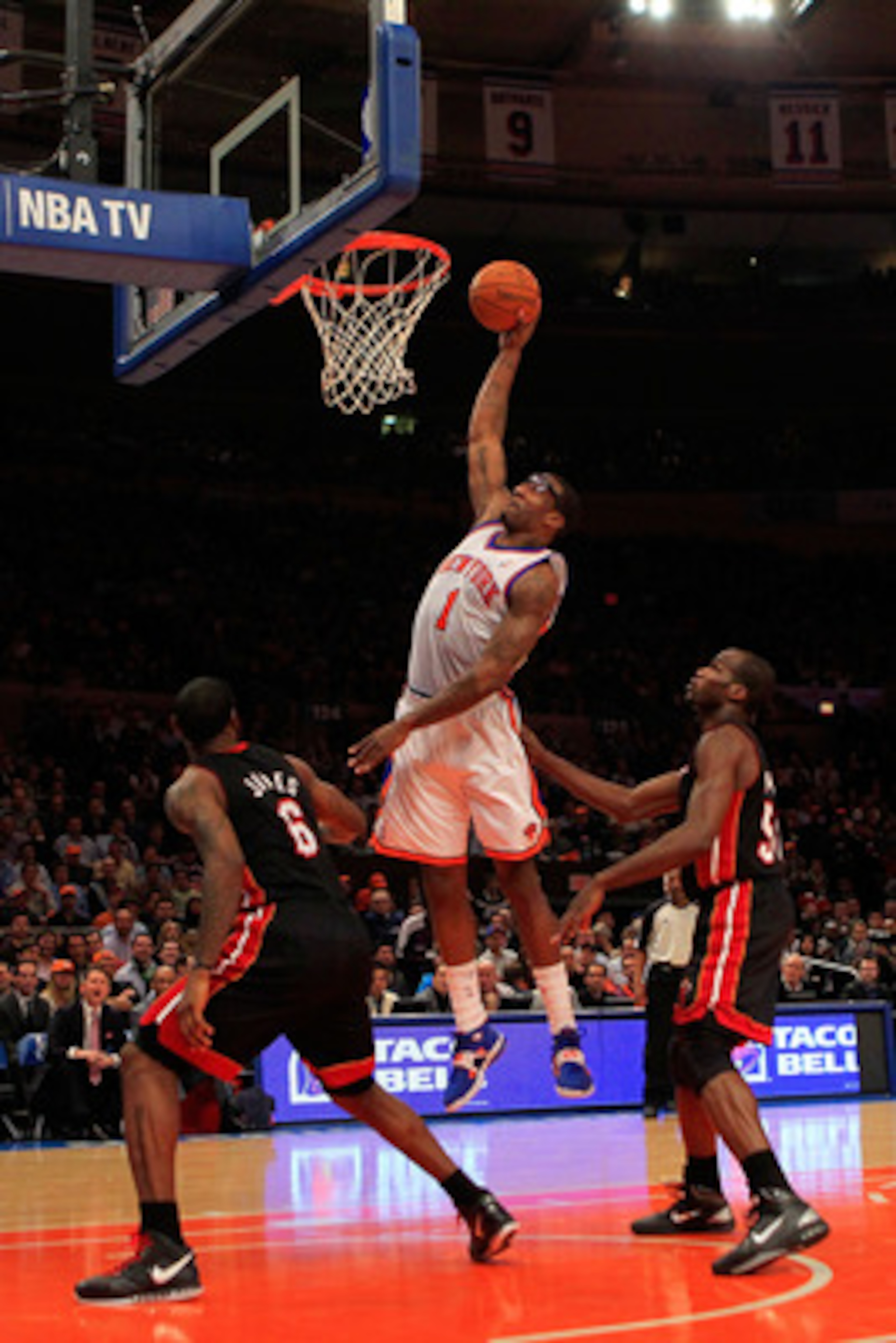 NEW YORK, NY - JANUARY 27:  Amar'e Stoudemire #1 of the New York Knicks lays the ball up against the Miami Heat at Madison Square Garden on January 27, 2011 in New York City. NOTE TO USER: User expressly acknowledges and agrees that, by downloading and/or