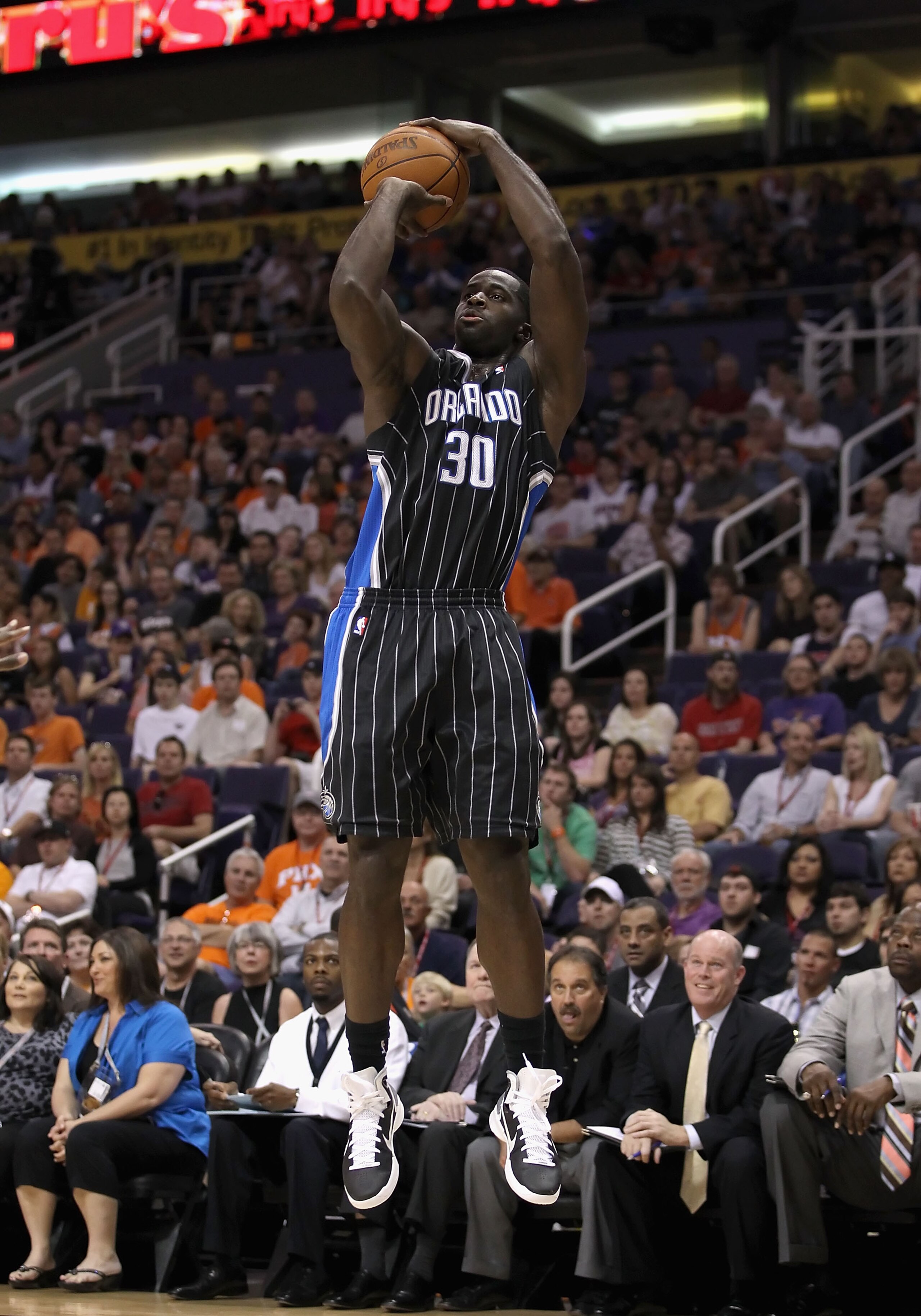 PHOENIX, AZ - MARCH 13:  Brandon Bass #30 of the Orlando Magic puts up a shot during the NBA game against the Phoenix Suns at US Airways Center on March 13, 2011 in Phoenix, Arizona. The Magic defeated the Suns 111-88. NOTE TO USER: User expressly acknowl