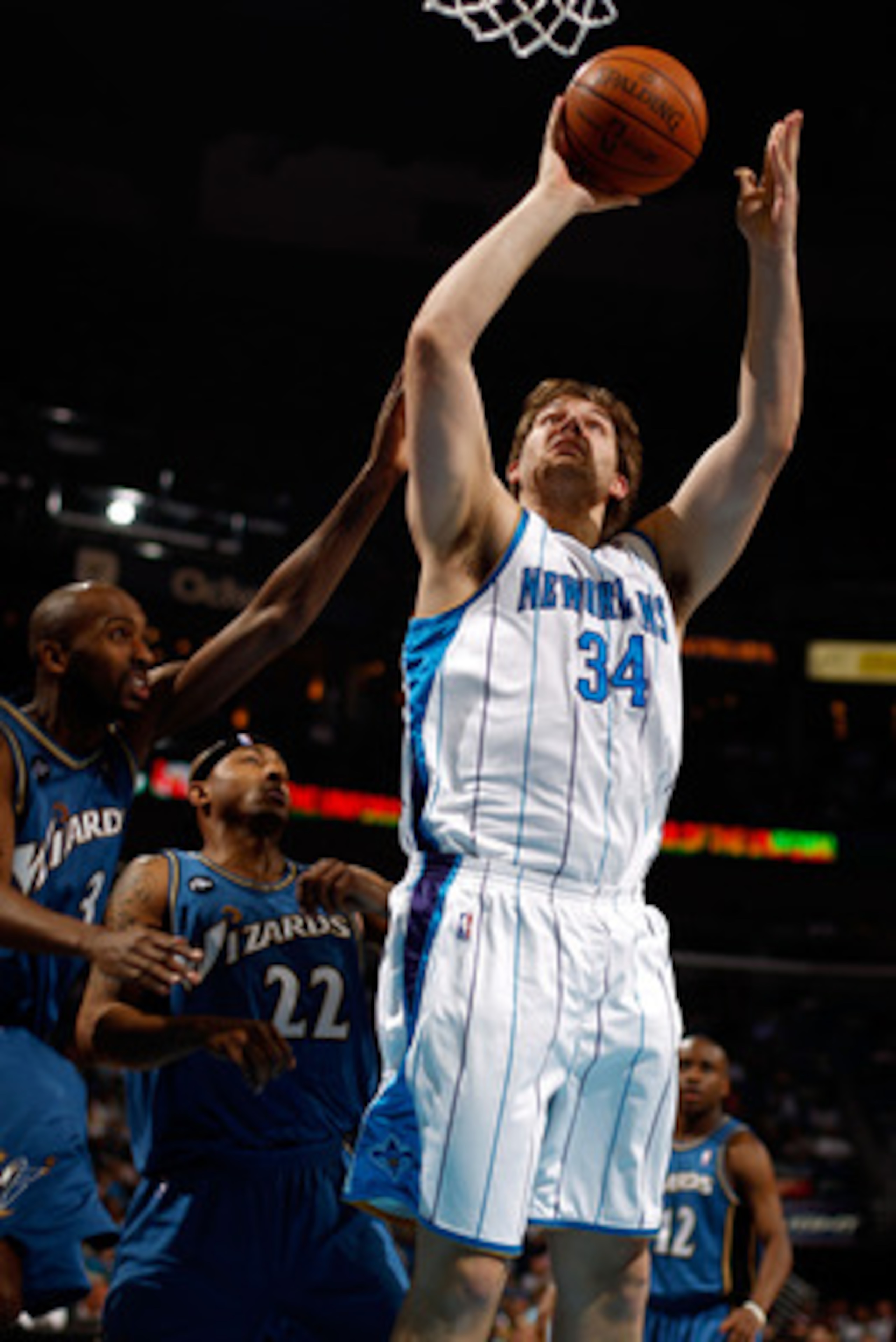 NEW ORLEANS - MARCH 31:  Aaron Gray #34 of the New Orleans Hornets shoots the ball over Quinton Ross #3 of the Washington Wizards at New Orleans Arena on March 31, 2010 in New Orleans, Louisiana.  The Wizards defeated the Hornets 96-91.  NOTE TO USER: Use