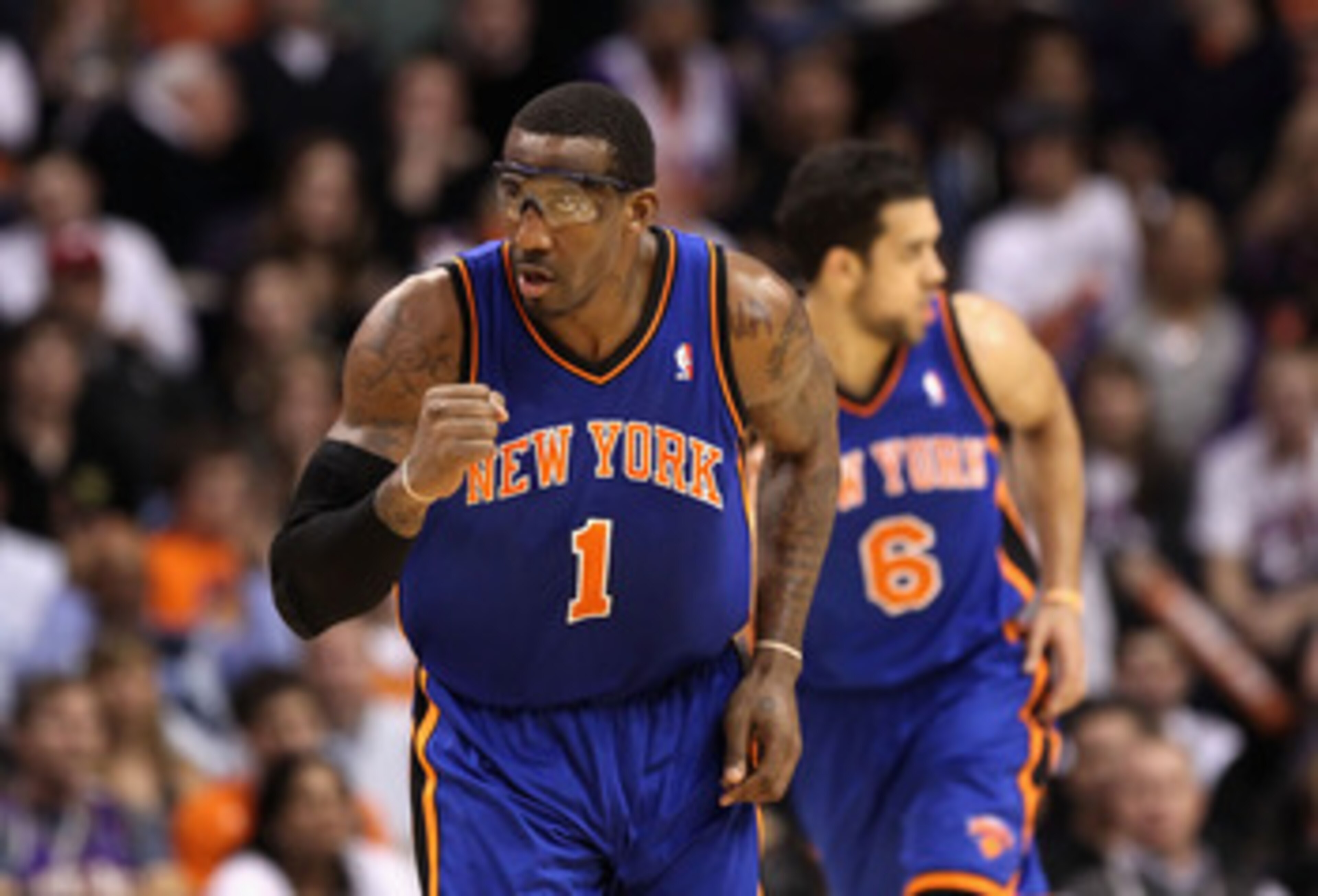 PHOENIX - JANUARY 07:  Amar'e Stoudemire #1 of the New York Knicks pumps his fist after Landry Fields #6 hit a three point shot against the Phoenix Suns during the NBA game at US Airways Center on January 7, 2011 in Phoenix, Arizona.  The Knicks defeated 