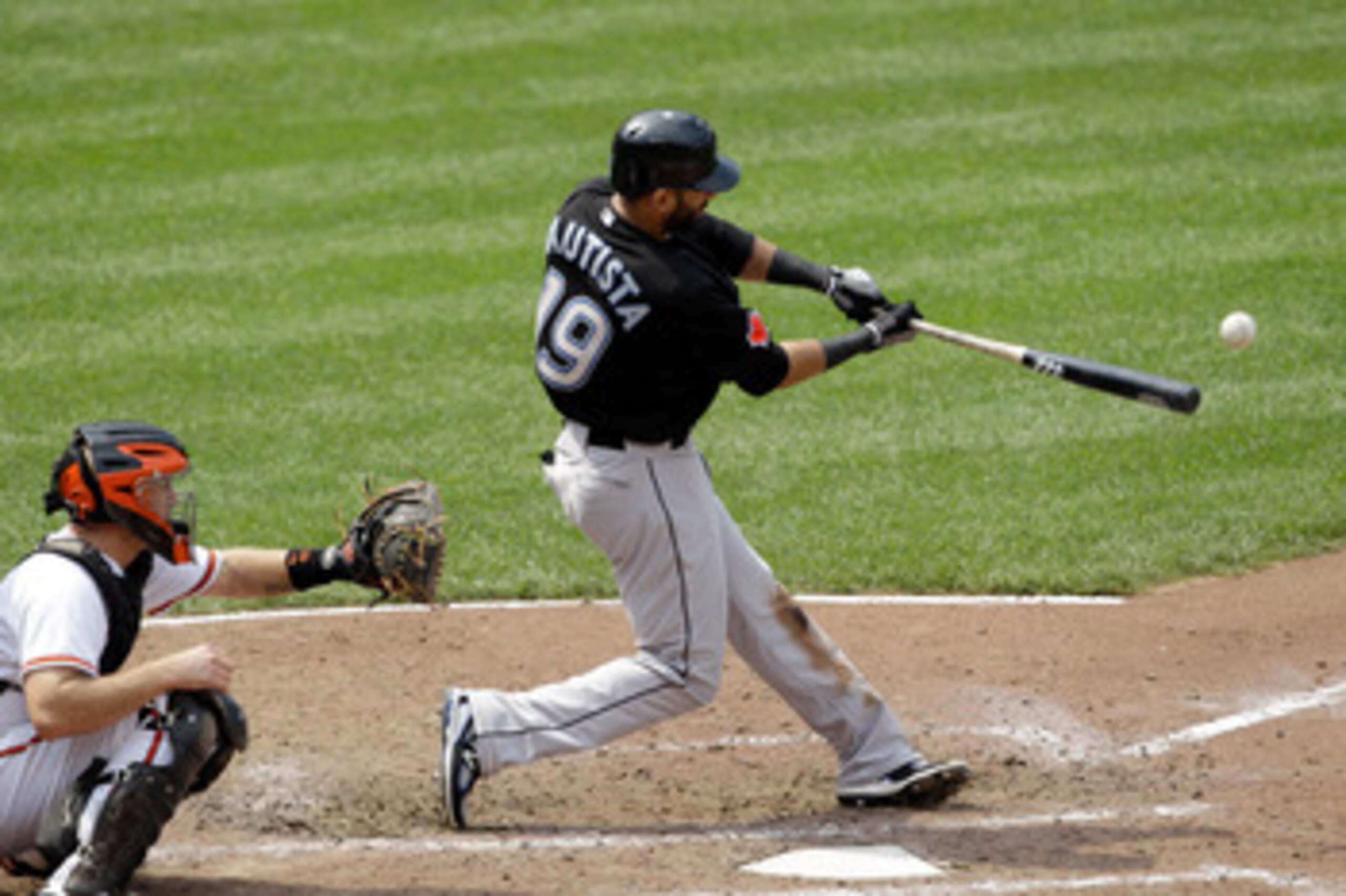 BALTIMORE, MD - JUNE 05:  Catcher Craig Tatum #15 of the Baltimore Orioles looks on as Jose Bautista #19 of the Toronto Blue Jays connects for a hit at Oriole Park at Camden Yards on June 5, 2011 in Baltimore, Maryland.  (Photo by Rob Carr/Getty Images)