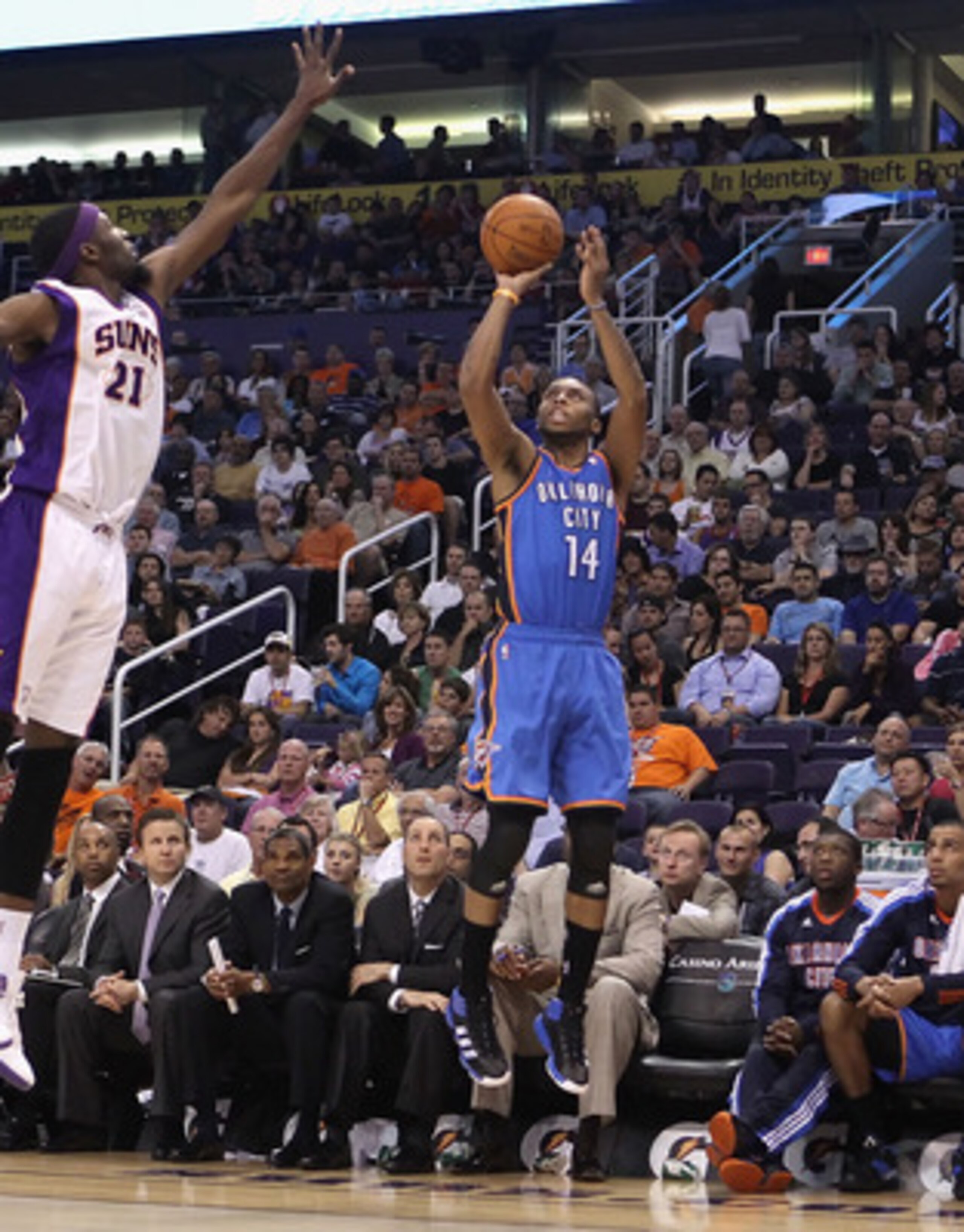 PHOENIX, AZ - MARCH 30:  Daequan Cook #14 of the Oklahoma City Thunder puts up a shot during the NBA game against the Phoenix Suns at US Airways Center on March 30, 2011 in Phoenix, Arizona. The Thunder defeated the Suns 116-98.   NOTE TO USER: User expre
