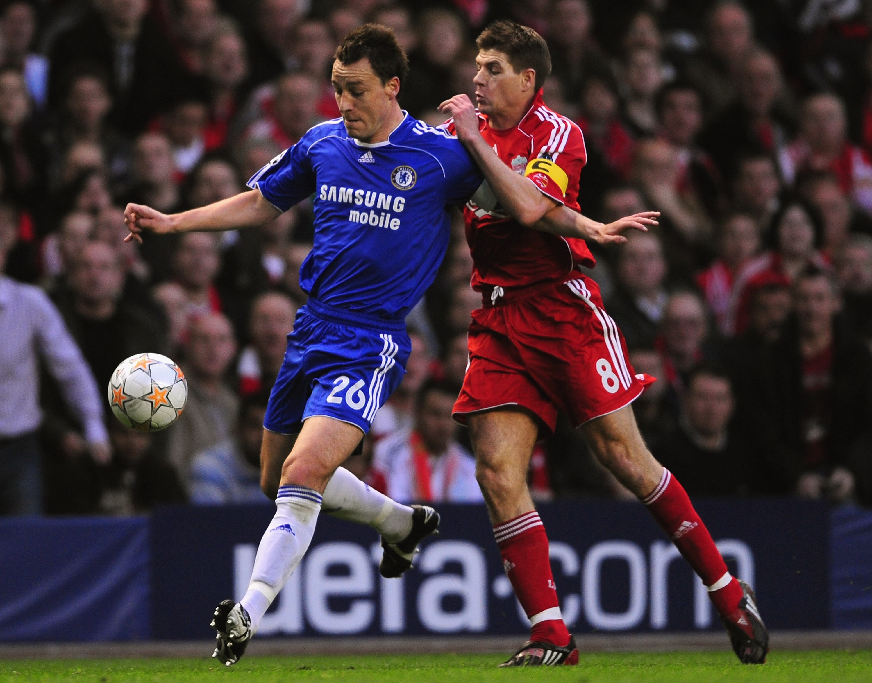 LIVERPOOL, UNITED KINGDOM - APRIL 22:  John Terry of Chelsea is challenged by Steven Gerrard of Liverpool during the UEFA Champions League Semi Final, first leg match between Liverpool and Chelsea at Anfield on April 22, 2008 in Liverpool, England. (Photo
