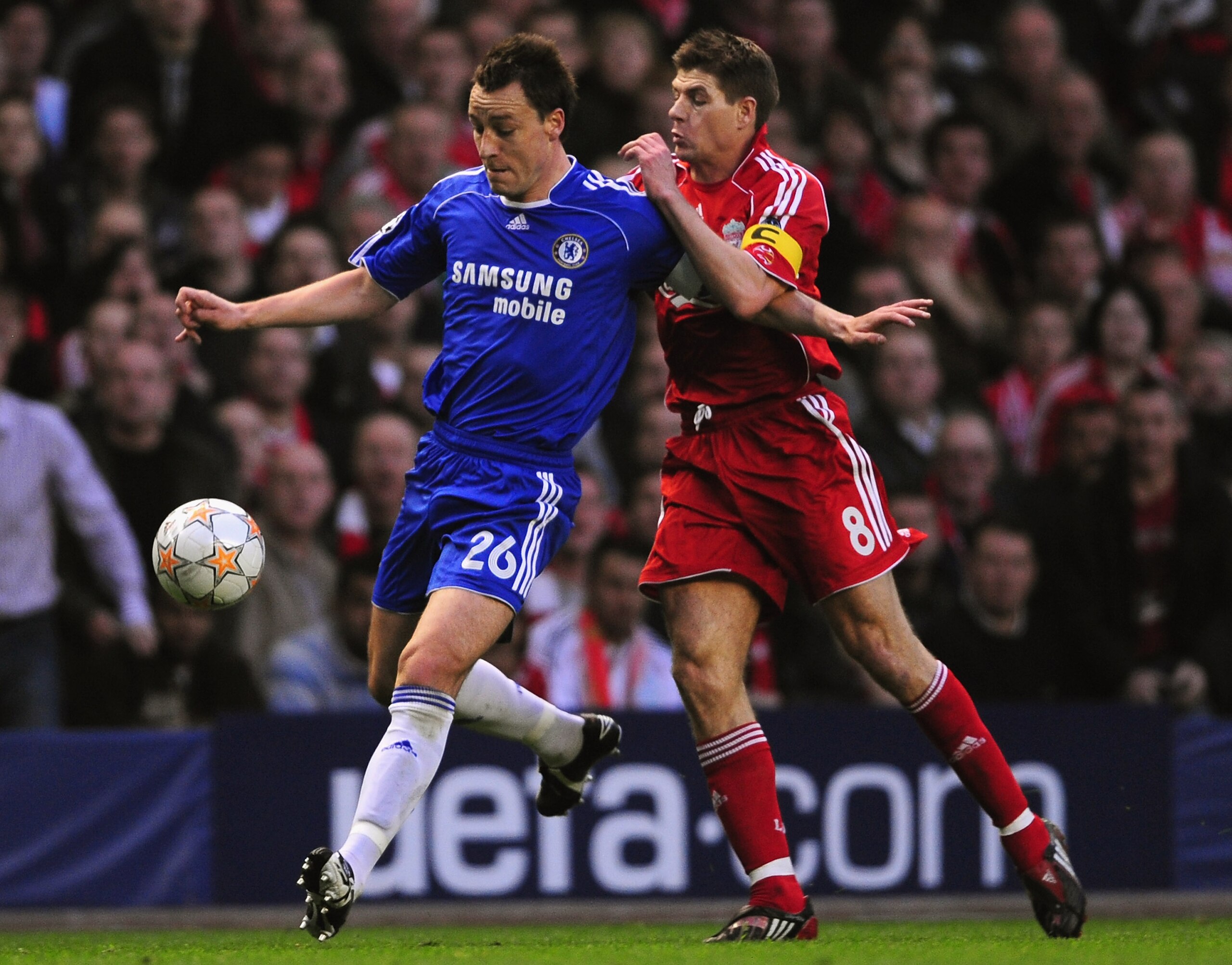LIVERPOOL, UNITED KINGDOM - APRIL 22:  John Terry of Chelsea is challenged by Steven Gerrard of Liverpool during the UEFA Champions League Semi Final, first leg match between Liverpool and Chelsea at Anfield on April 22, 2008 in Liverpool, England. (Photo