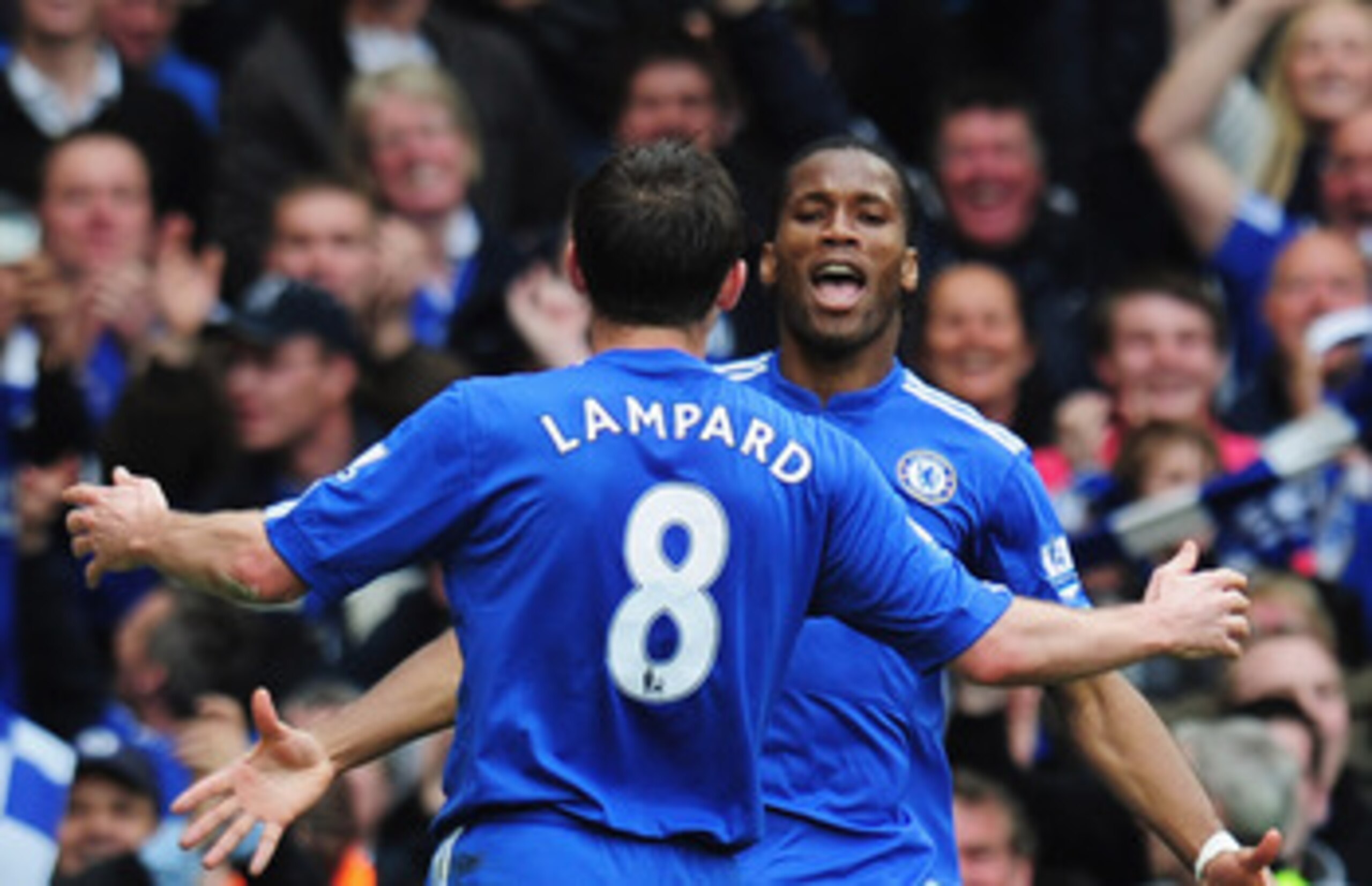 LONDON, ENGLAND - MAY 09:  Didier Drogba of Chelsea celebrates with team mate Frank Lampard as he scores their fifth goal during the Barclays Premier League match between Chelsea and Wigan Athletic at Stamford Bridge on May 9, 2010 in London, England.  (P