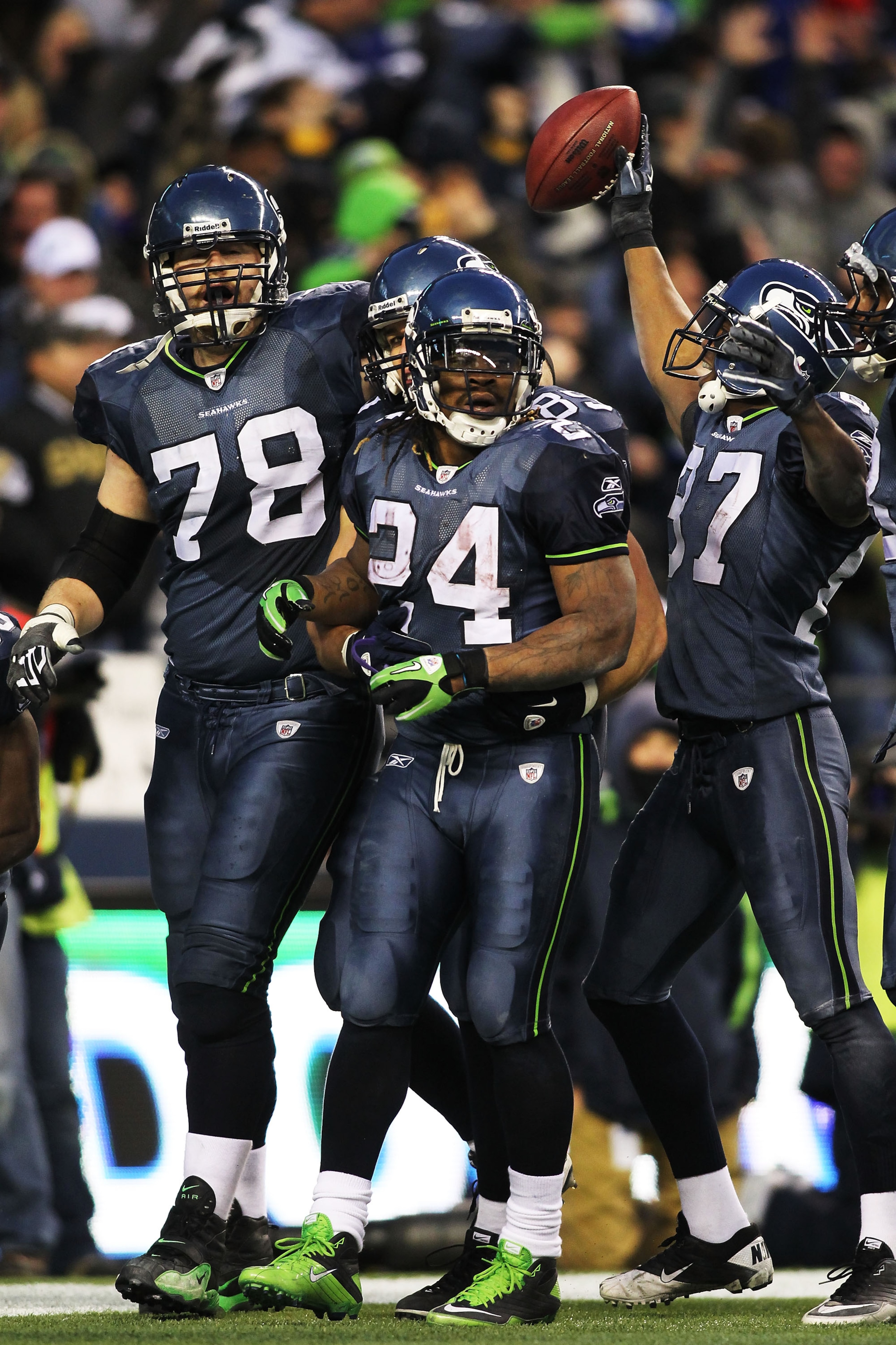 SEATTLE, WA - JANUARY 08:  Running back Marshawn Lynch #24 of the Seattle Seahawks celebrates his 67-yard touchdown run in the fourth quarter against the New Orleans Saints during the 2011 NFC wild-card playoff game at Qwest Field on January 8, 2011 in Se