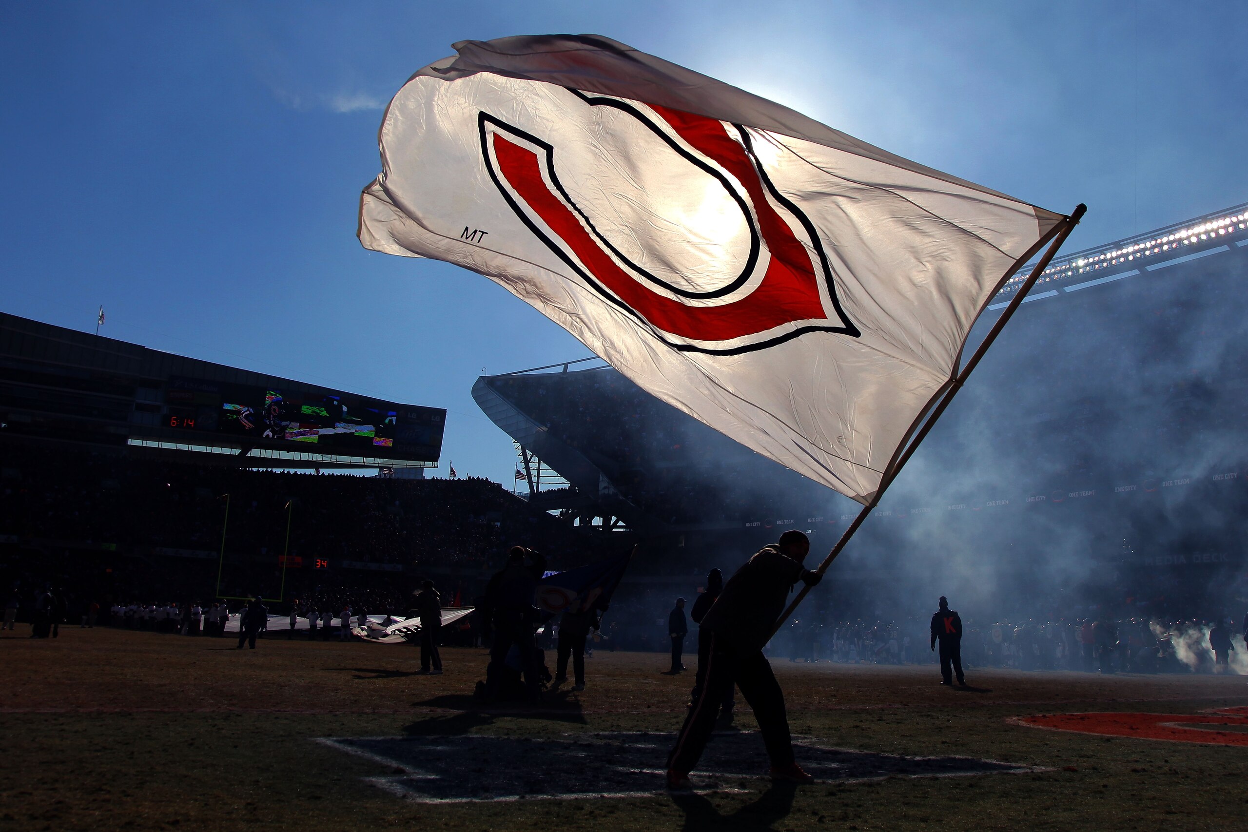 CHICAGO, IL - JANUARY 23:  A member of the Chicago Bears field team waves a Bears flag as the before the Bears take on the Green Bay Packers in the NFC Championship Game at Soldier Field on January 23, 2011 in Chicago, Illinois.  (Photo by Doug Pensinger/