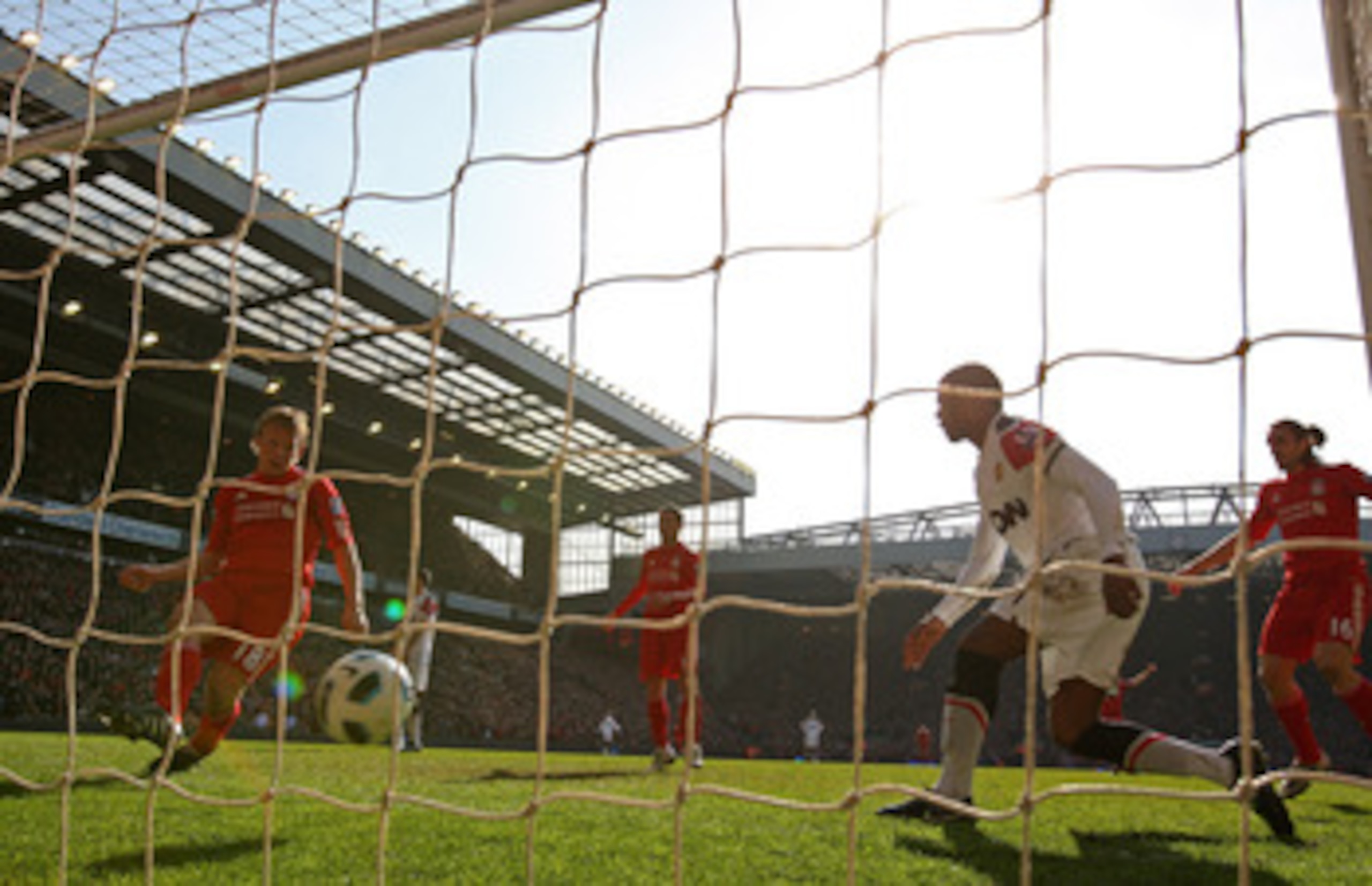 LIVERPOOL, ENGLAND - MARCH 06:  Dirk Kuyt of Liverpool scores the opening goal during the Barclays Premier League match between Liverpool and Manchester United at Anfield on March 6, 2011 in Liverpool, England.  (Photo by Alex Livesey/Getty Images)