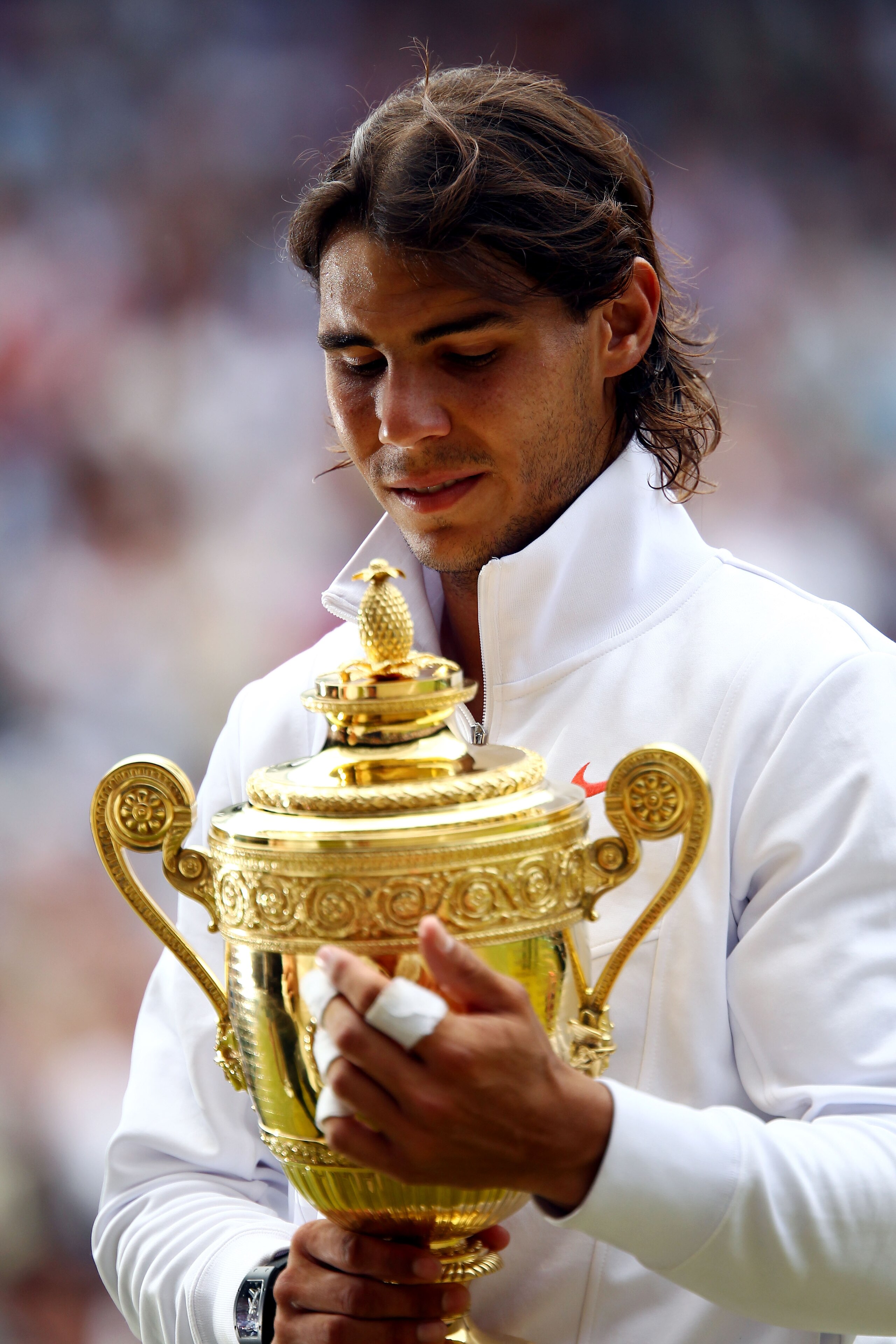 LONDON, ENGLAND - JULY 04:  Rafael Nadal of Spain holds the Championship trophy after winning the Men's Singles Final match against Tomas Berdych of Czech Republic on Day Thirteen of the Wimbledon Lawn Tennis Championships at the All England Lawn Tennis a