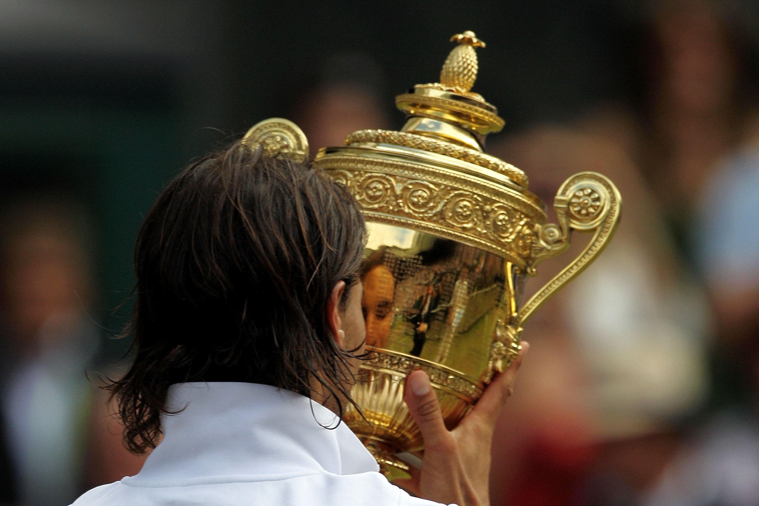 LONDON, ENGLAND - JULY 04:  Rafael Nadal of Spain holds the Championship trophy after winning the Men's Singles Final match against Tomas Berdych of Czech Republic on Day Thirteen of the Wimbledon Lawn Tennis Championships at the All England Lawn Tennis a