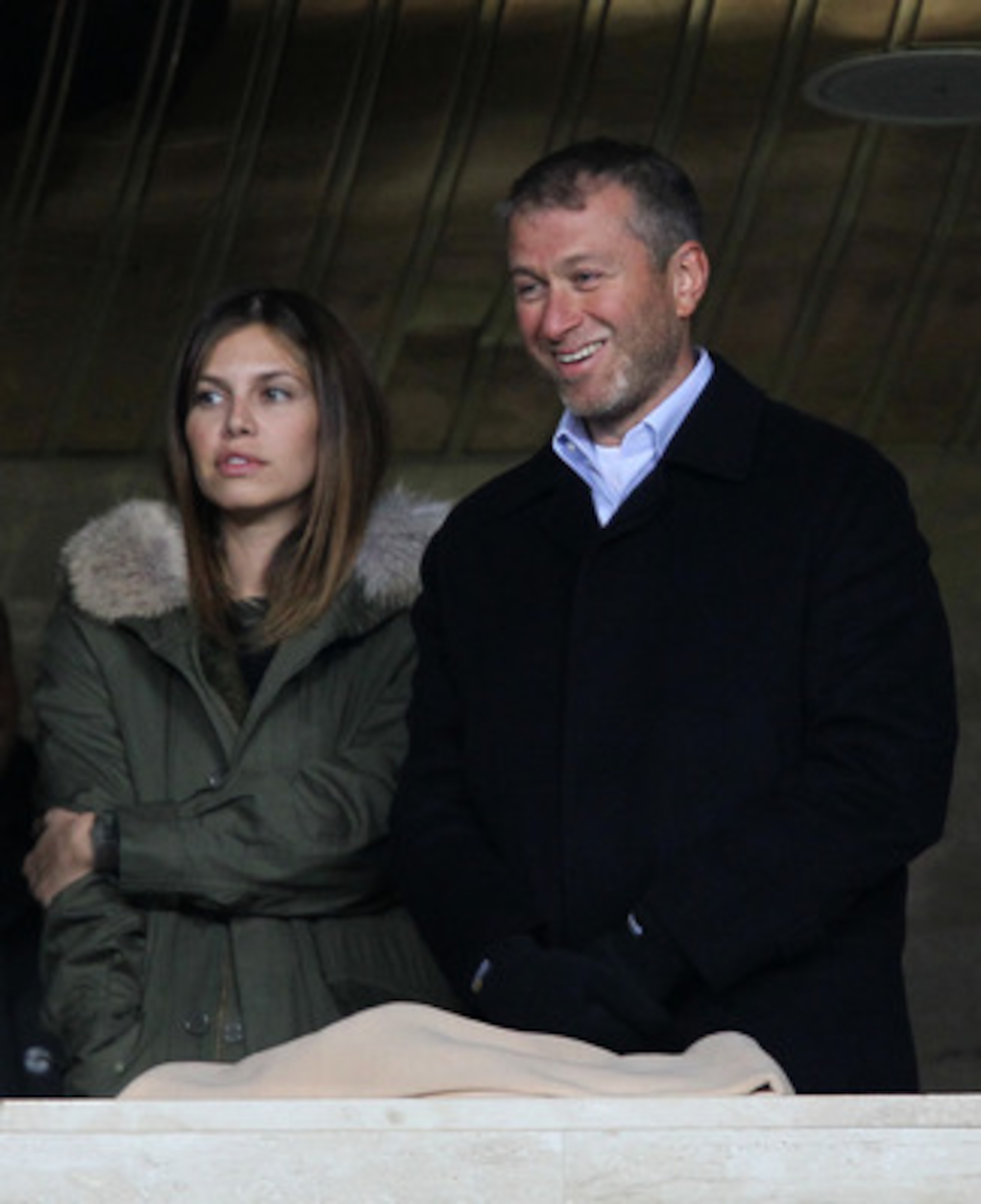 MOSCOW, RUSSIA - OCTOBER 19: Chelsea owner Roman Abramovich looks on with his girlfriend Daria Zhukova prior to the UEFA Champions League Group F match between FC Spartak Moscow and Chelsea  at the Luzhniki Stadium on October 19, 2010 in Moscow, Russia.