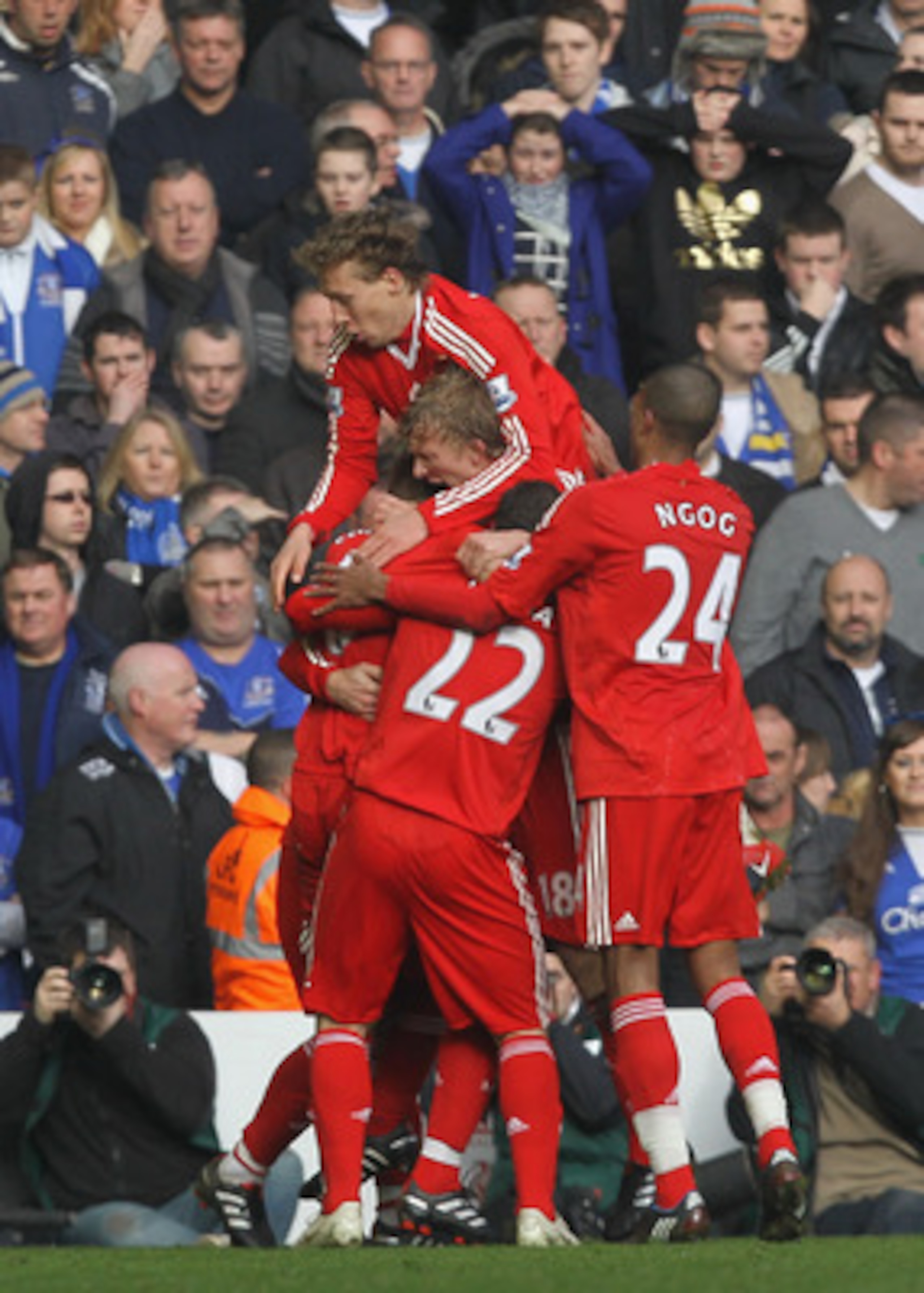 LIVERPOOL, ENGLAND - FEBRUARY 06:  Dirk Kuyt of Liverpool celebrates with his team mates after scoring the opening goal during the Barclays Premier League match between Liverpool and Everton at Anfield on February 6, 2010 in Liverpool, England.  (Photo by