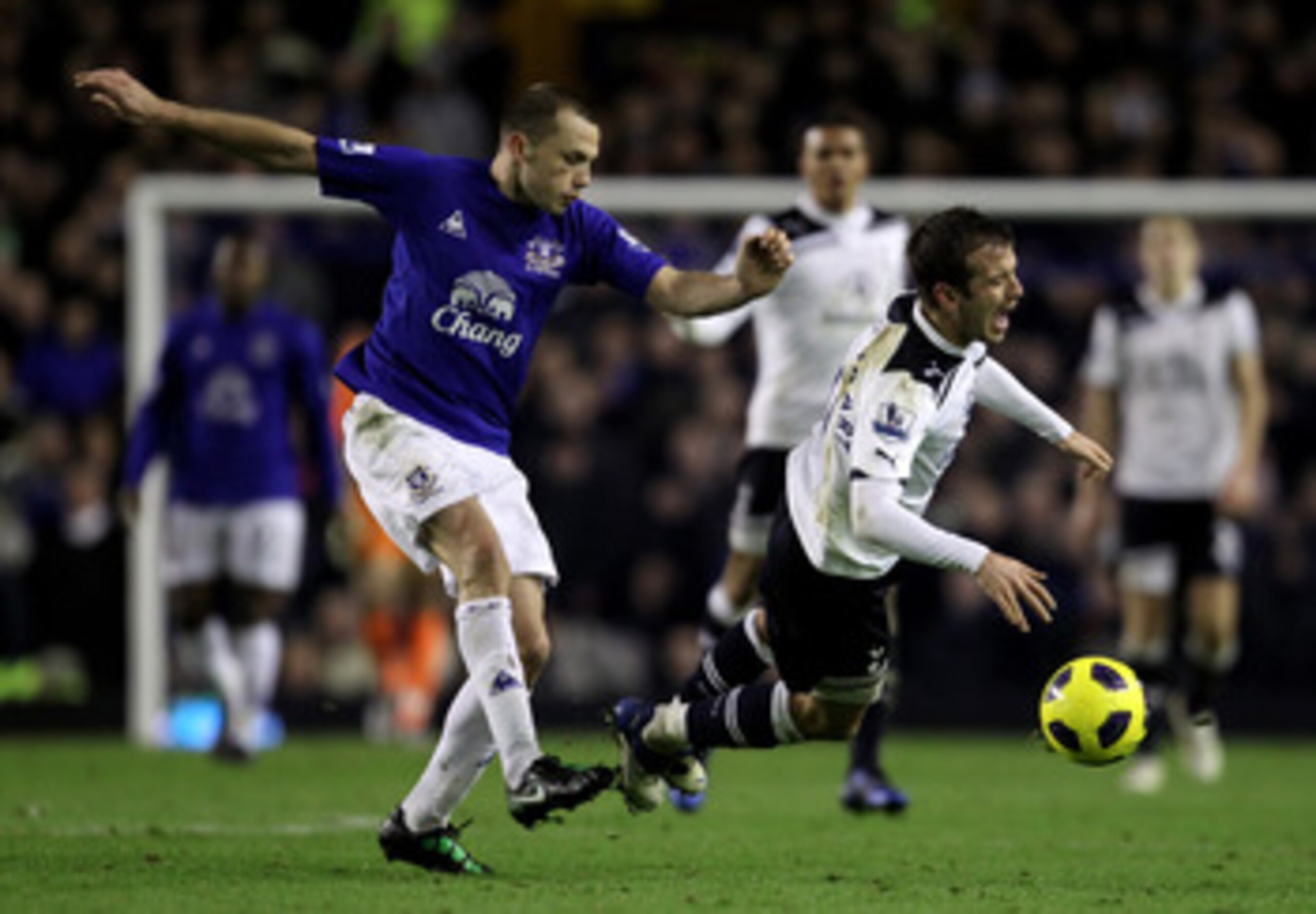 LIVERPOOL, ENGLAND - JANUARY 05: Rafael Van der Vaart of Tottenham Hotspur is challenged by John Heitinga of Everton during the Barclays Premier League match between Everton and Tottenham Hotspur at Goodison Park on January 5, 2011 in Liverpool, England. LIVERPOOL, ENGLAND - JANUARY 05: Rafael Van der Vaart of Tottenham Hotspur is challenged by John Heitinga of Everton during the Barclays Premier League match between Everton and Tottenham Hotspur at Goodison Park on January 5, 2011 in Liverpool, England.