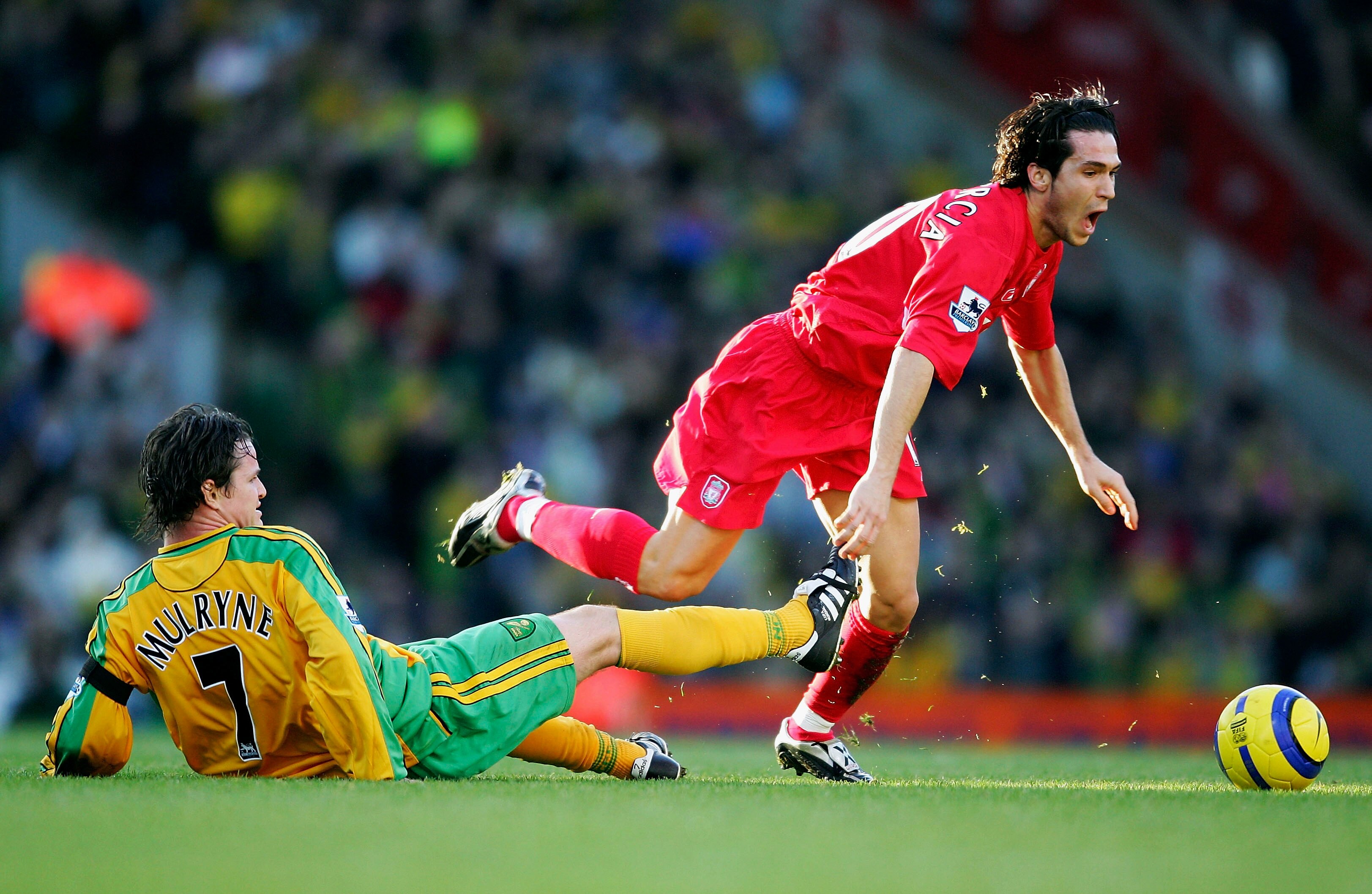 NORWICH, ENGLAND - JANUARY 3:  Luis Garcia of Liverpool is tackled by Phil Mulryne of Norwich during the Barclays Premiership match between Norwich City and Liverpool at Carrow Road on January 3, 2005 in Norwich, England. (Photo by Jamie McDonald/Getty Im