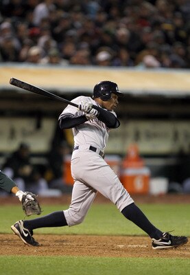 OAKLAND, CA - MAY 31:  Curtis Granderson #14 of the New York Yankees bats against the Oakland Athletics at Oakland-Alameda County Coliseum on May 31, 2011 in Oakland, California.  (Photo by Ezra Shaw/Getty Images)