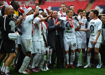 LONDON, ENGLAND - MAY 30: Brendan Rogers (c) of Swansea City celebrates with his players after victory in the npower Championship Playoff Final between Reading and Swansea City at Wembley Stadium on May 30, 2011 in London, England.  (Photo by Laurence Gri