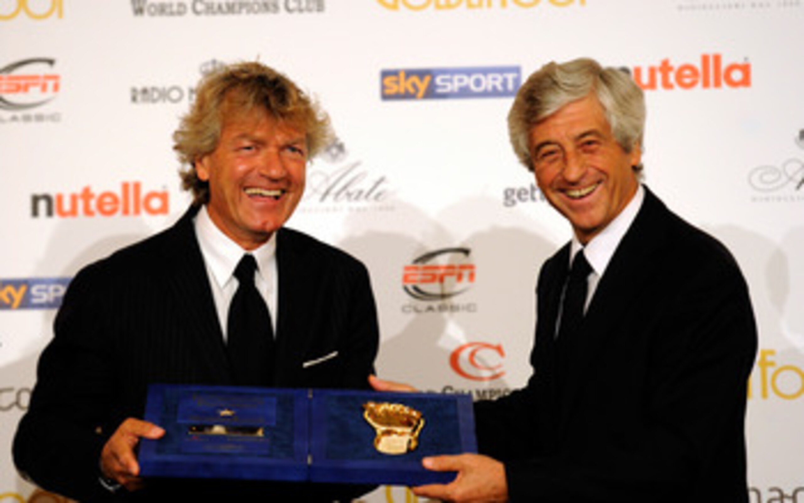 MONACO - OCTOBER 11:  Giancarlo Antognoni (L) and Gianni Rivera during the Golden Foot Awards ceremony at Fairmont Hotel on October 11, 2010 in Monaco, Monaco.  (Photo by Claudio Villa/Getty Images for Golden Foot)