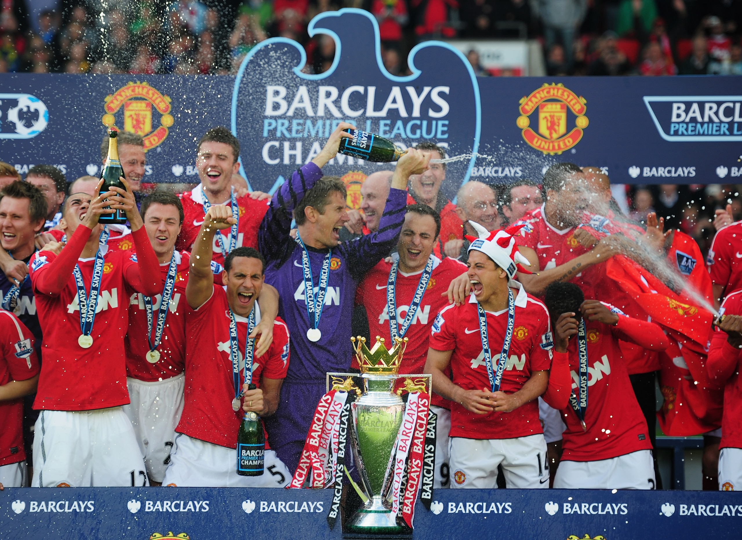 MANCHESTER, ENGLAND - MAY 22:  Manchester United celebrate with the Premier League trophy after the Barclays Premier League match between Manchester United and Blackpool at Old Trafford on May 22, 2011 in Manchester, England. Manchester United celebrate a