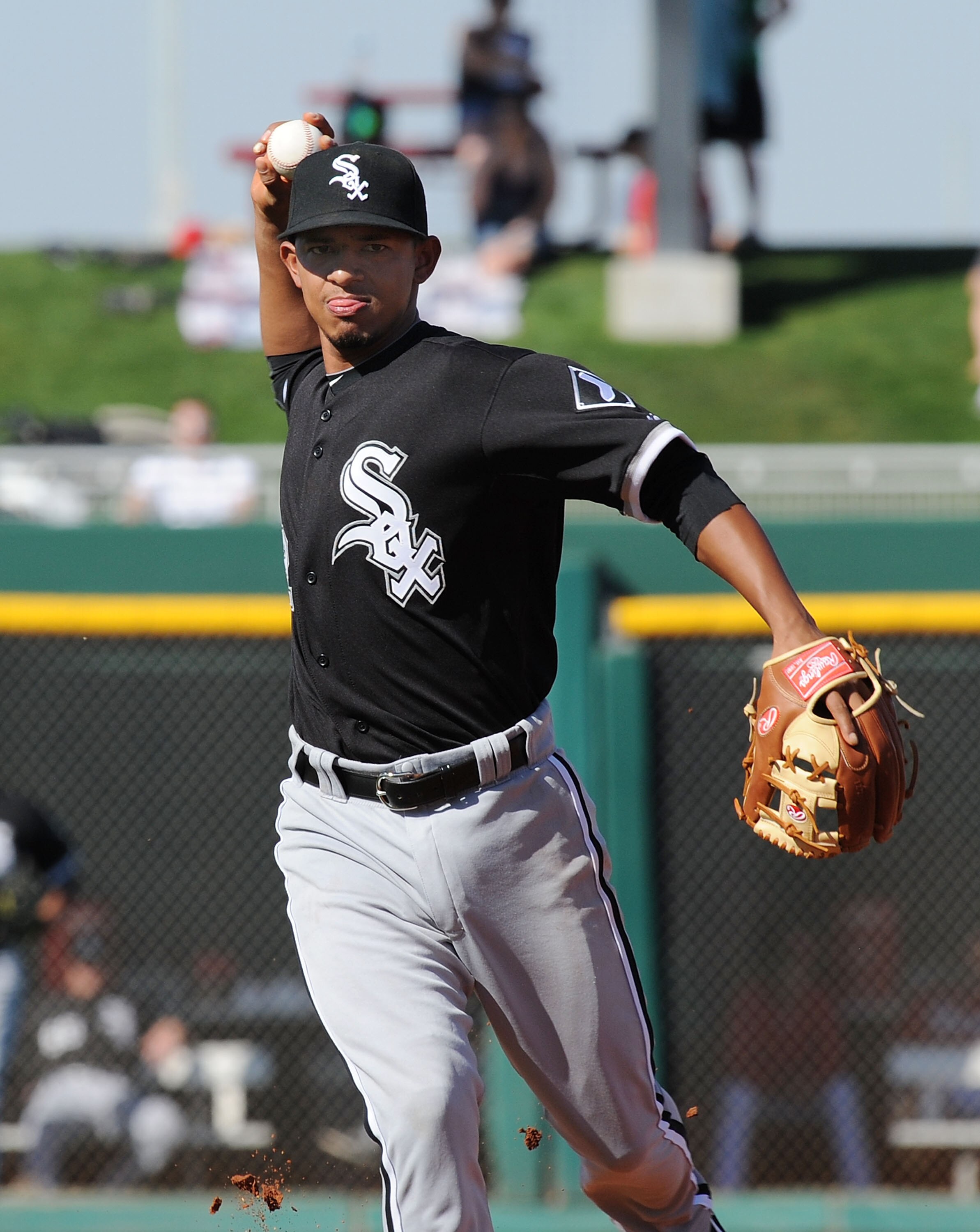 GOODYEAR, AZ - MARCH 02:  Eduardo Escobar #62 of the Chicago White Sox throws the ball to first base against the Cincinnati Reds during a spring training game at Goodyear Ballpark on March 2, 2011 in Goodyear, Arizona.  (Photo by Norm Hall/Getty Images)