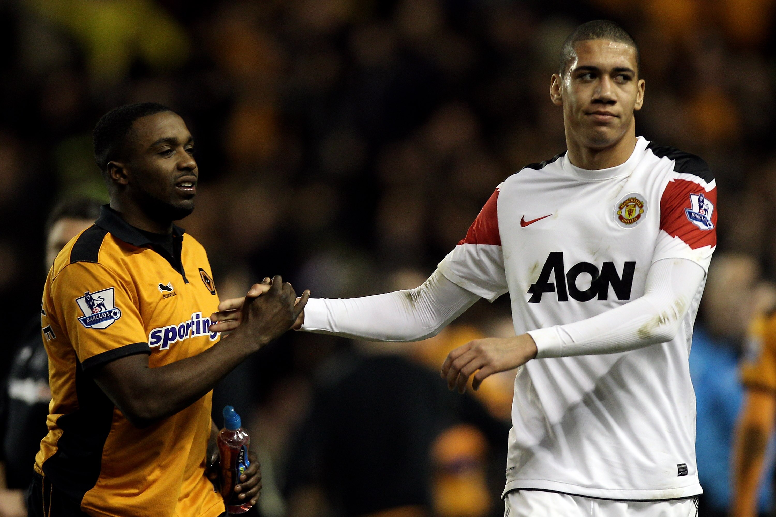 WOLVERHAMPTON, ENGLAND - FEBRUARY 05:  Sylvan Ebanks Blake (L) of Wolves shakes hands with Chris Smalling of Manchester United after the Barclays Premier League match between Wolverhampton Wanderers and Manchester United at Molineux on February 5, 2011 in
