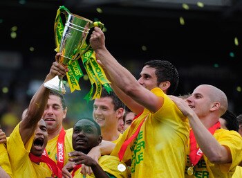 NORWICH, ENGLAND - MAY 07:  Norwich City players celebrate promotion during the npower Championship match between Norwich City and Coventry City at Carrow Road on May 7, 2011 in Norwich, England.  (Photo by Jamie McDonald/Getty Images)