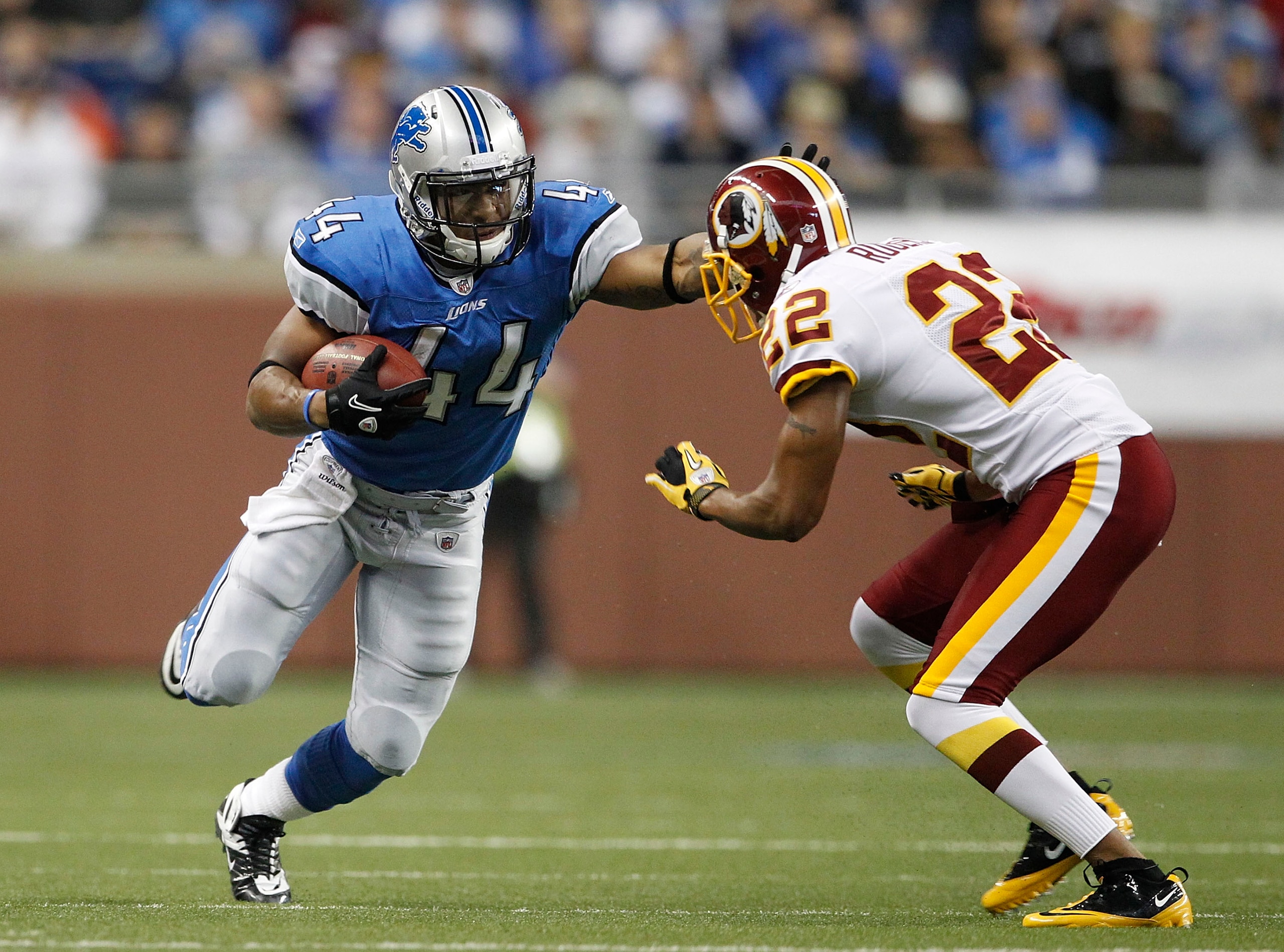 DETROIT - OCTOBER 31: Jahvid Best #44 of the Detroit Lions runs for a first down as Carlos Rogers #22 of the Washington Redskins gets ready to make the stop during the first quarter of the game at Ford Field on October 31, 2010 in Detroit, Michigan. (Phot