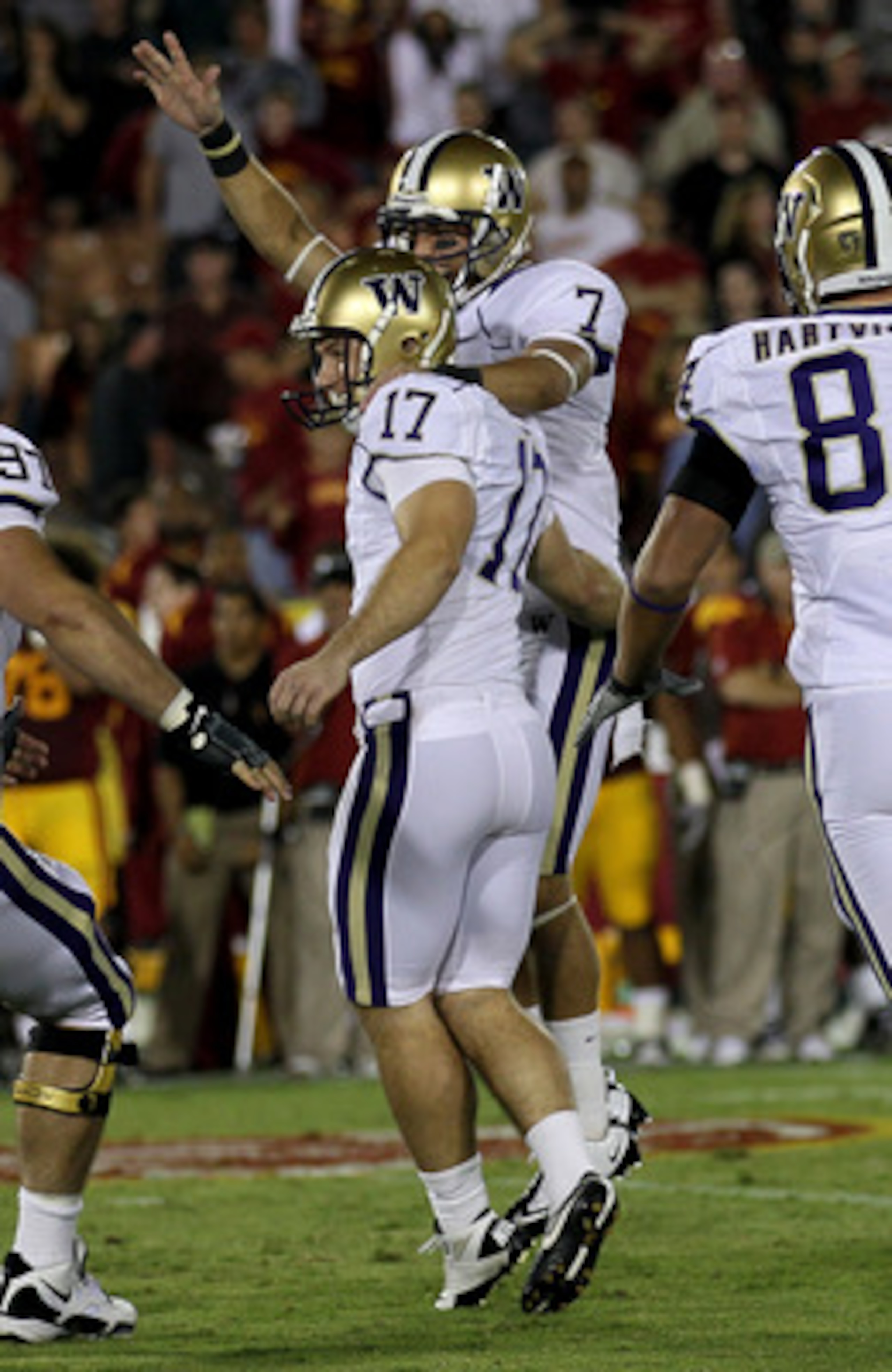 LOS ANGELES, CA - OCTOBER 02:  Kicker Erik Folk #17 and holder Cody Bruns #7 of the Washington Huskies celebrate after Folk's game winning field goal as time ran out in the game with the USC Trojans at the Los Angeles Memorial Coliseum on October 2, 2010