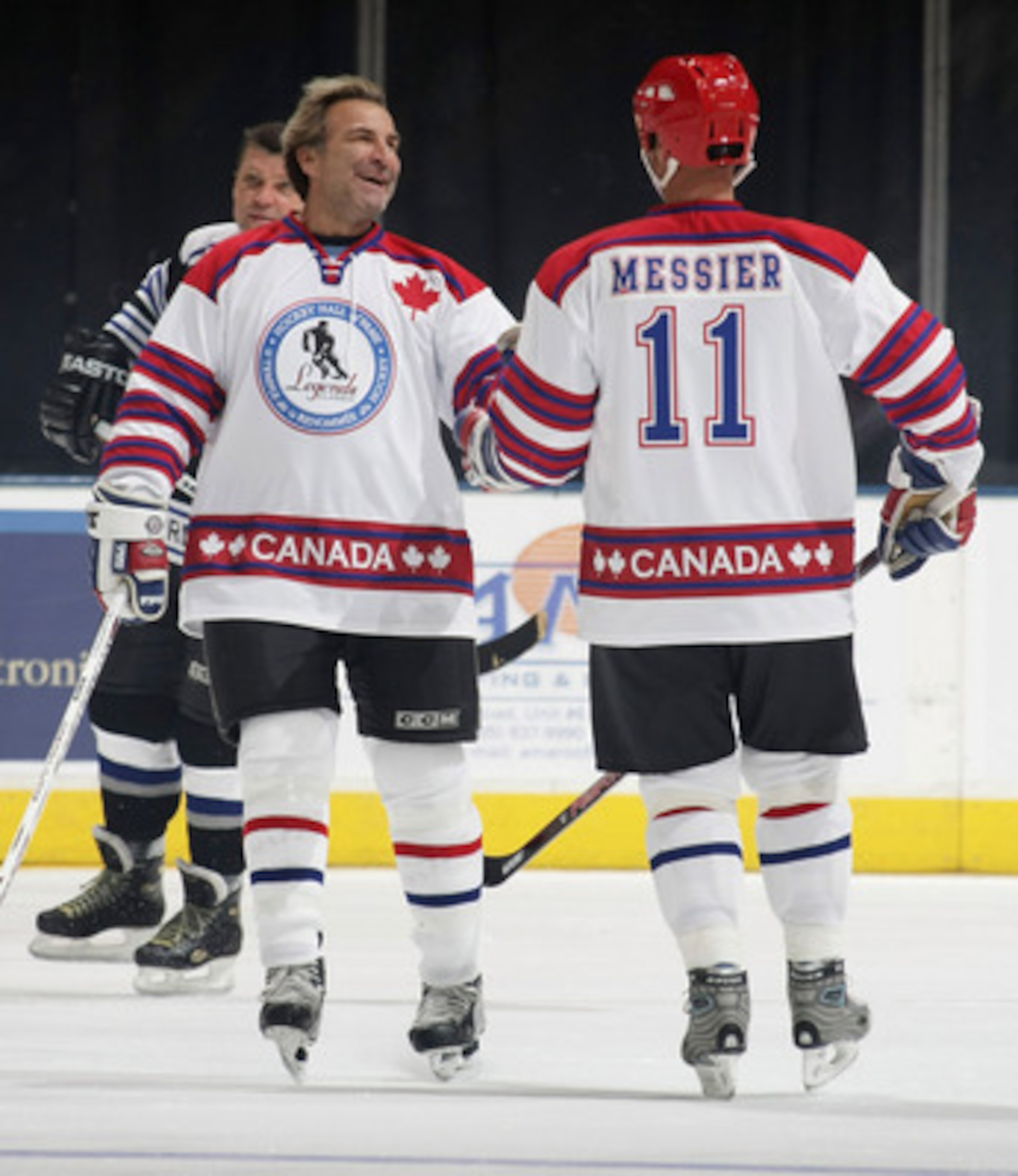 TORONTO, ON - NOVEMBER 08: Glenn Anderson #9 and Mark Messier #11 celebrate a goal by Anderson at the Hockey Hall of Fame Legends Game at the Air Canada Centre on November 8, 2009 in Toronto, Canada. (Photo by Bruce Bennett/Getty Images)