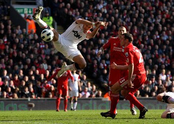 LIVERPOOL, UNITED KINGDOM - MARCH 06:  Javier Hernandez of Manchester United competes with Jamie Carragher of Liverpool during the Barclays Premier League match between Liverpool and Manchester United at Anfield on March 6, 2011 in Liverpool, England. (Ph