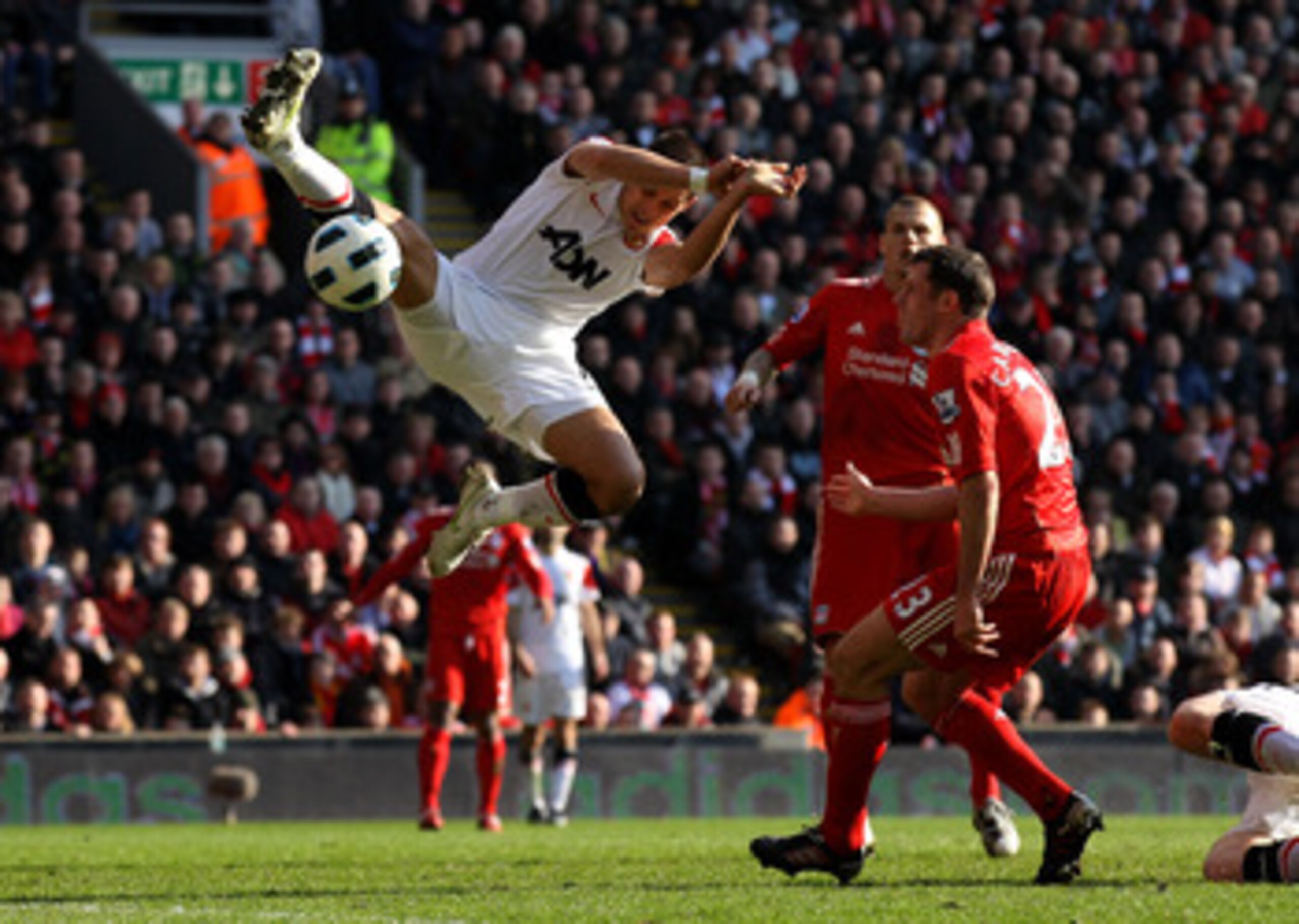 LIVERPOOL, UNITED KINGDOM - MARCH 06: Javier Hernandez of Manchester United competes with Jamie Carragher of Liverpool during the Barclays Premier League match between Liverpool and Manchester United at Anfield on March 6, 2011 in Liverpool, England. (Ph LIVERPOOL, UNITED KINGDOM - MARCH 06: Javier Hernandez of Manchester United competes with Jamie Carragher of Liverpool during the Barclays Premier League match between Liverpool and Manchester United at Anfield on March 6, 2011 in Liverpool, England. (Ph