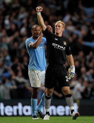 MANCHESTER, UNITED KINGDOM - MAY 10:  Joe Hart and Vincent Kompany (L) of Manchester City celebrate at the end of the Barclays Premier League match between Manchester City and Tottenham Hotspur at the City of Manchester Stadium on May 10, 2011 in Manchest