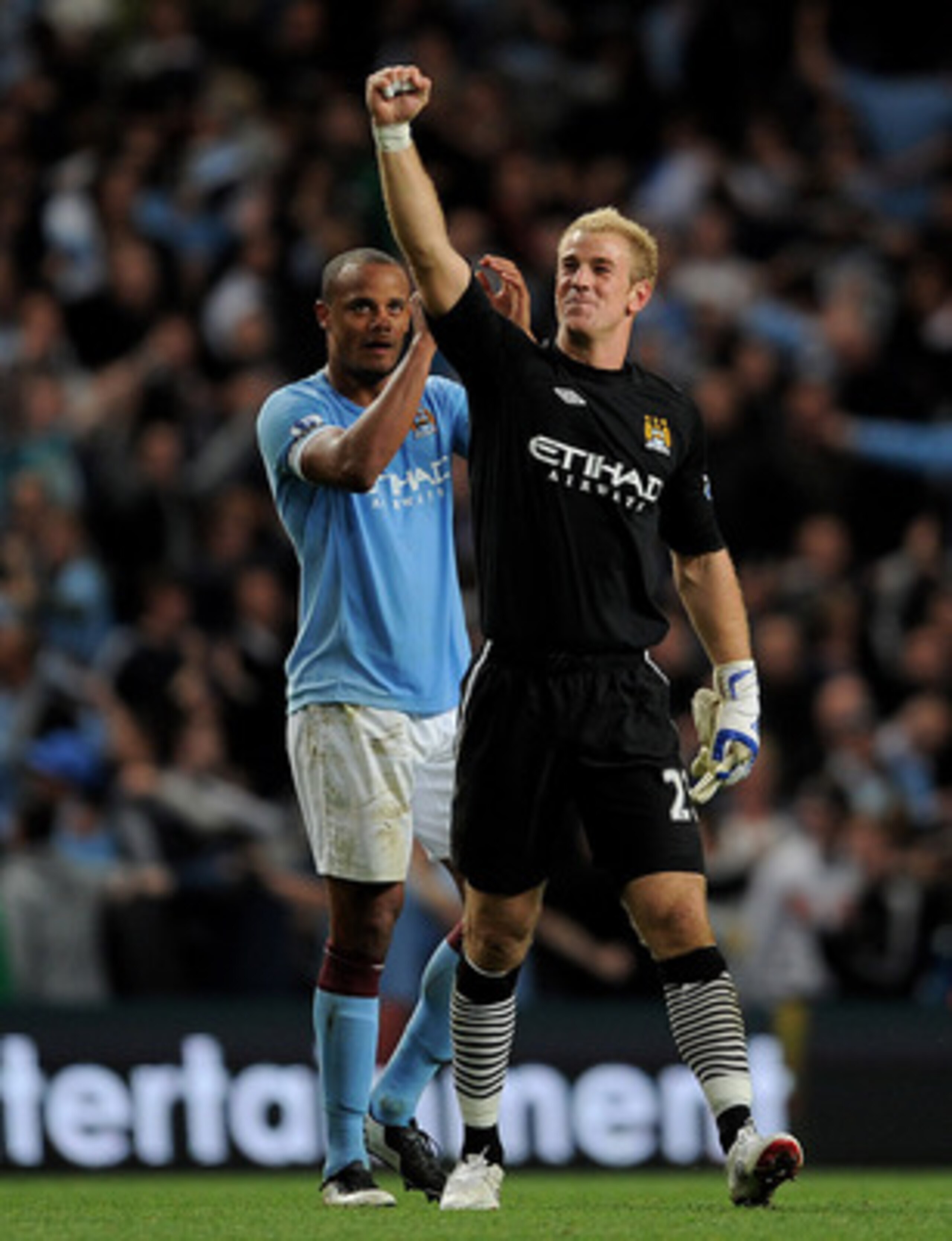 MANCHESTER, UNITED KINGDOM - MAY 10: Joe Hart and Vincent Kompany (L) of Manchester City celebrate at the end of the Barclays Premier League match between Manchester City and Tottenham Hotspur at the City of Manchester Stadium on May 10, 2011 in Manchest MANCHESTER, UNITED KINGDOM - MAY 10: Joe Hart and Vincent Kompany (L) of Manchester City celebrate at the end of the Barclays Premier League match between Manchester City and Tottenham Hotspur at the City of Manchester Stadium on May 10, 2011 in Manchest