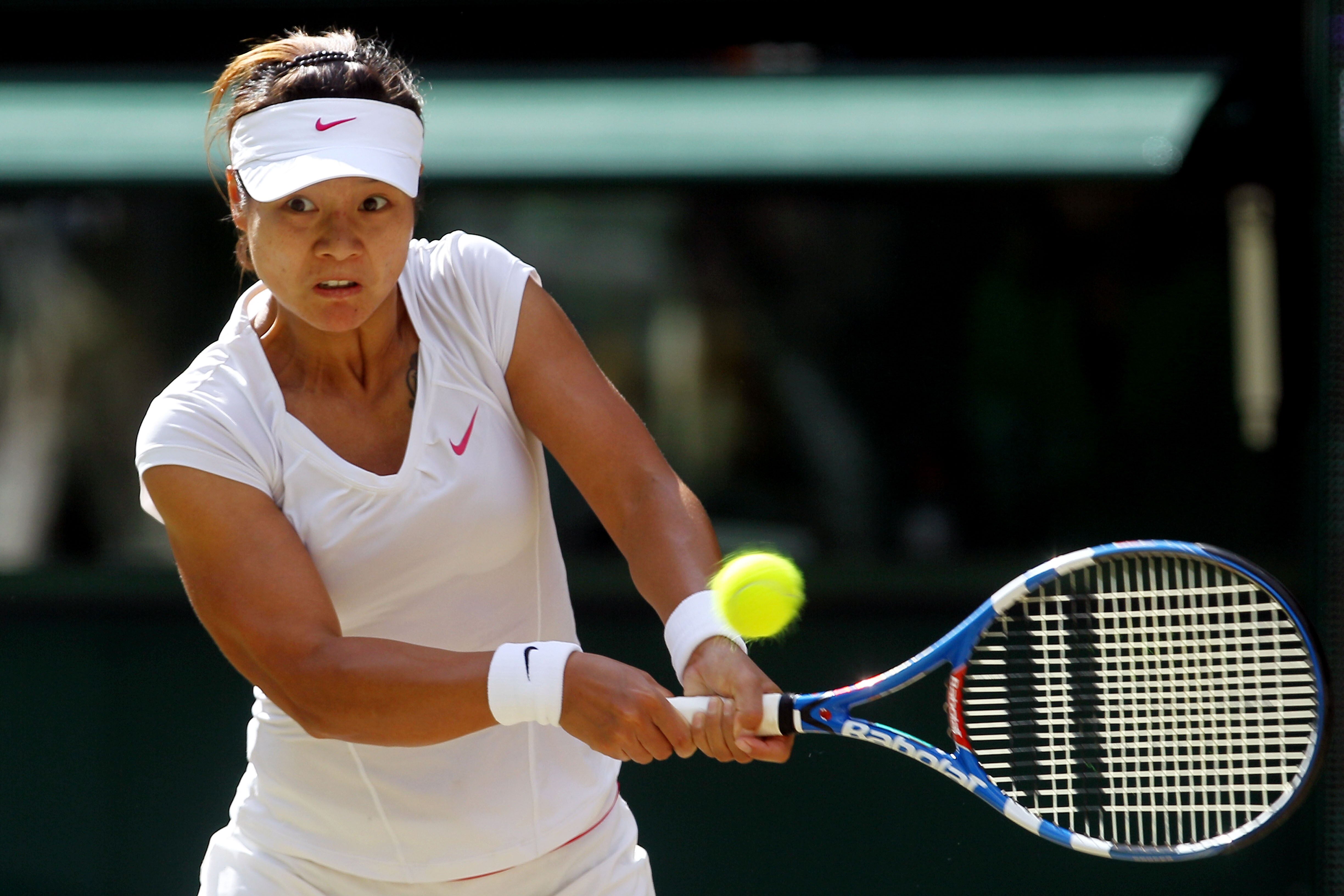 LONDON, ENGLAND - JUNE 29:  Na Li of China plays a shot a point during her Quarter Final match against Serena Williams of USA on Day Eight of the Wimbledon Lawn Tennis Championships at the All England Lawn Tennis and Croquet Club on June 29, 2010 in Londo
