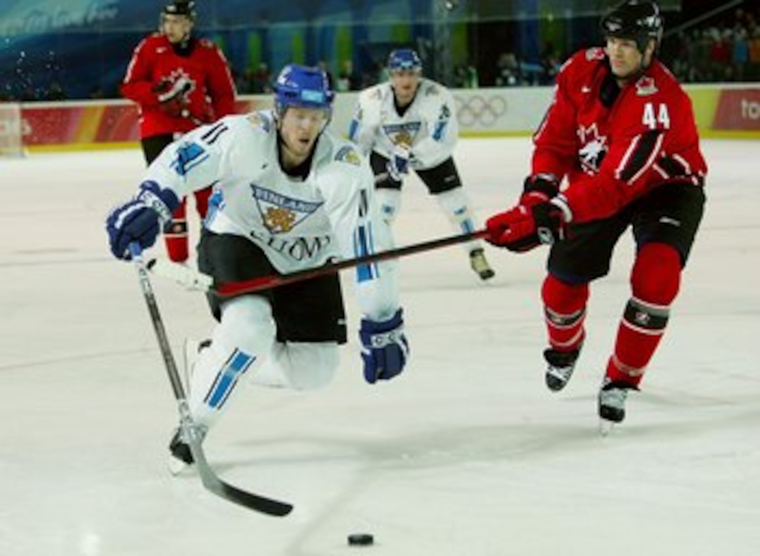 TURIN, ITALY - FEBRUARY 19: Chris Pronger #44 of Canada tries to hook Saku Koivu #11 of Finland during the men's ice hockey Preliminary Round Group A match between Finland and Canada during Day 9 of the Turin 2006 Winter Olympic Games on February 19, 2006