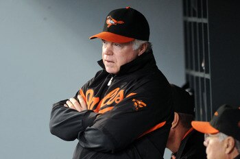 SEATTLE, WA - JUNE 1: Buck Showalter, manager of the Baltimore Orioles confers with his coaches during the game against the Seattle Mariners at Safeco Field on June 1, 2011 in Seattle, Washington. The Baltimore Orioles defeated the Seattle Mariners, 2-1.