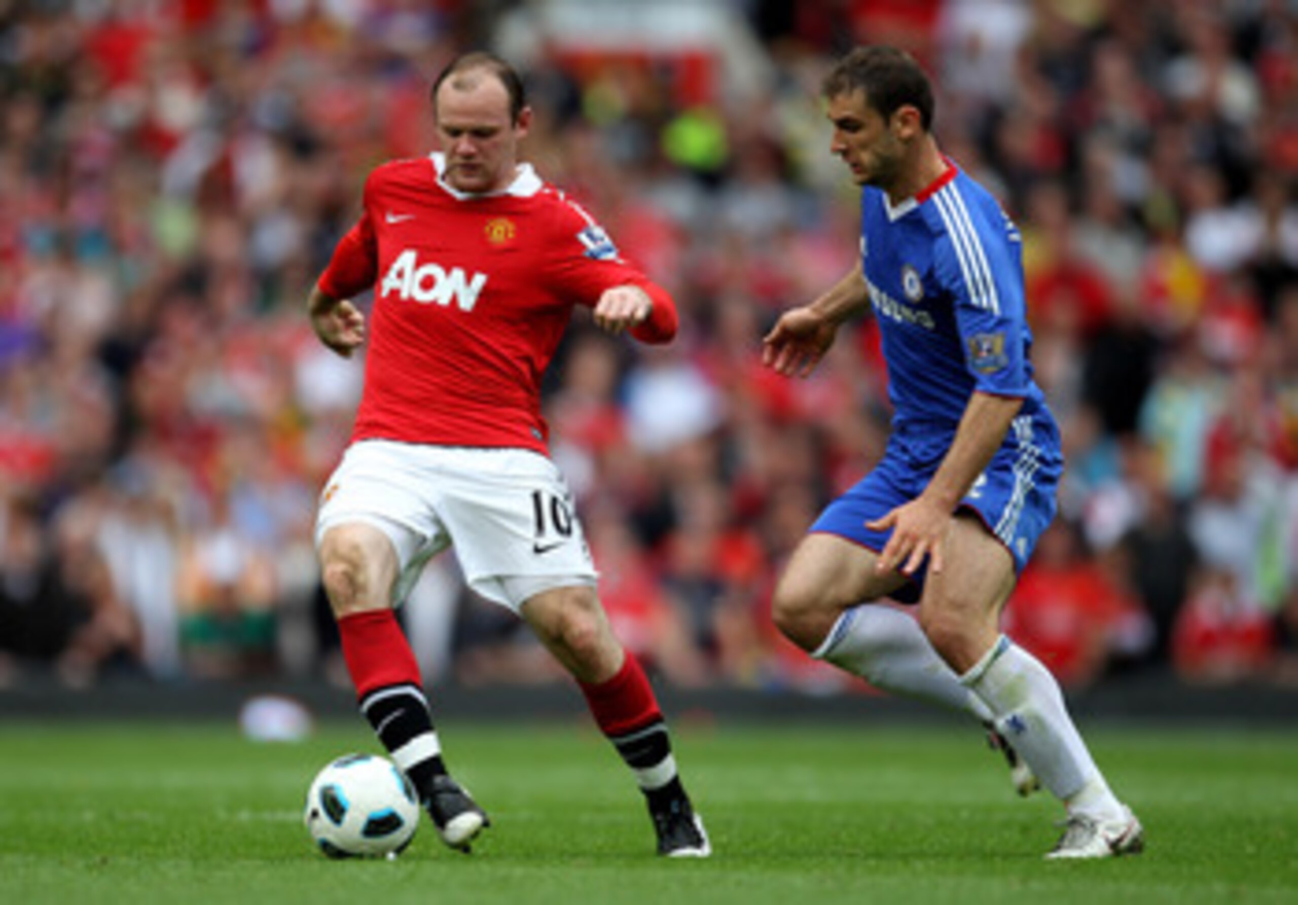 MANCHESTER, ENGLAND - MAY 08: Wayne Rooney of Manchester United competes with Branislav Ivanovic of Chelsea during the Barclays Premier League match between Manchester United and Chelsea at Old Trafford on May 8, 2011 in Manchester, England. (Photo by A MANCHESTER, ENGLAND - MAY 08: Wayne Rooney of Manchester United competes with Branislav Ivanovic of Chelsea during the Barclays Premier League match between Manchester United and Chelsea at Old Trafford on May 8, 2011 in Manchester, England. (Photo by A