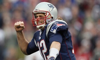 FOXBORO, MA - JANUARY 02:  Tom Brady #12 of the New England Patriots celebrates a touchdown by teammate BenJarvis Green-Ellis in the first quarter against the Miami Dolphins on January 2, 2011 at Gillette Stadium in Foxboro, Massachusetts.  (Photo by Elsa